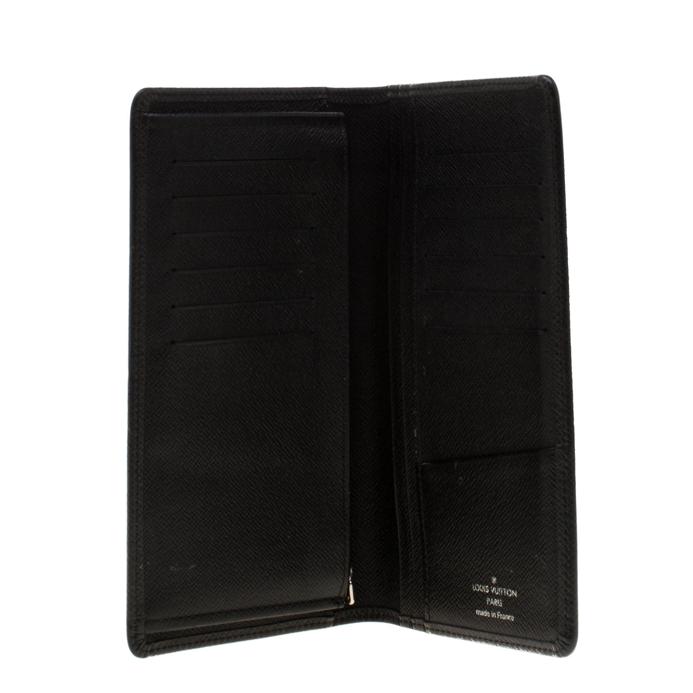 The Brazza wallet by Louis Vuitton will instantly become your favorite. It comes with multiple credit card slots, bill compartment, pockets, and a zipper compartment. Made from black Taiga leather, the wallet is designed in a sleek shape that fits
