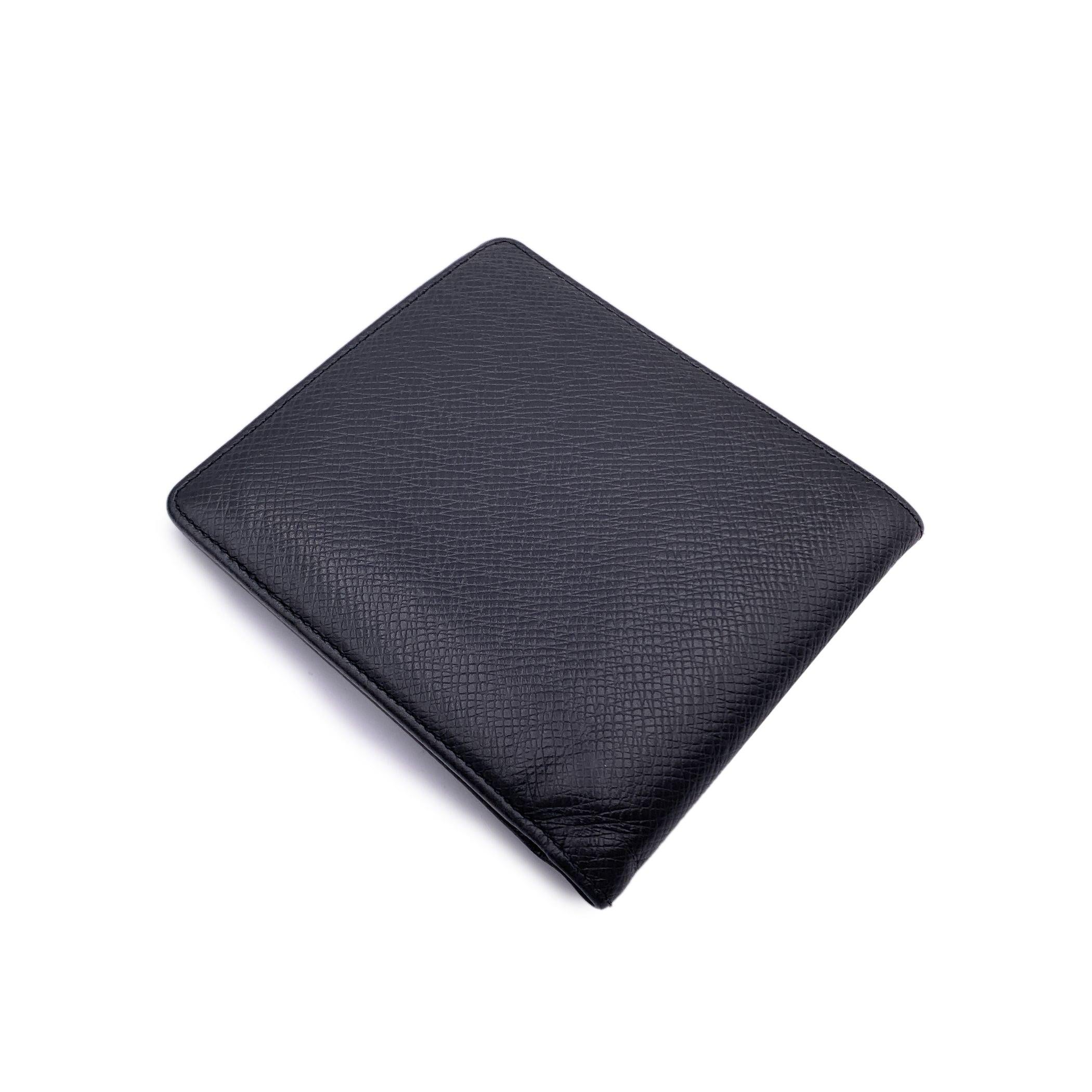 Louis Vuitton Black Taiga Leather Cards and Bill Bifold Wallet In Excellent Condition In Rome, Rome
