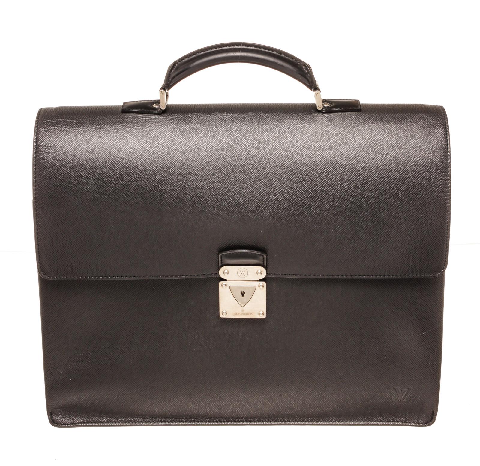 Louis Vuitton Black Taiga Leather Robusto 3 Briefcase Bag with taiga leather, silver-tone hardware, single rolled top handle, embossed logo accent at front corner, back exterior slit pocket, grey tonal canvas lining, three interior compartments; one
