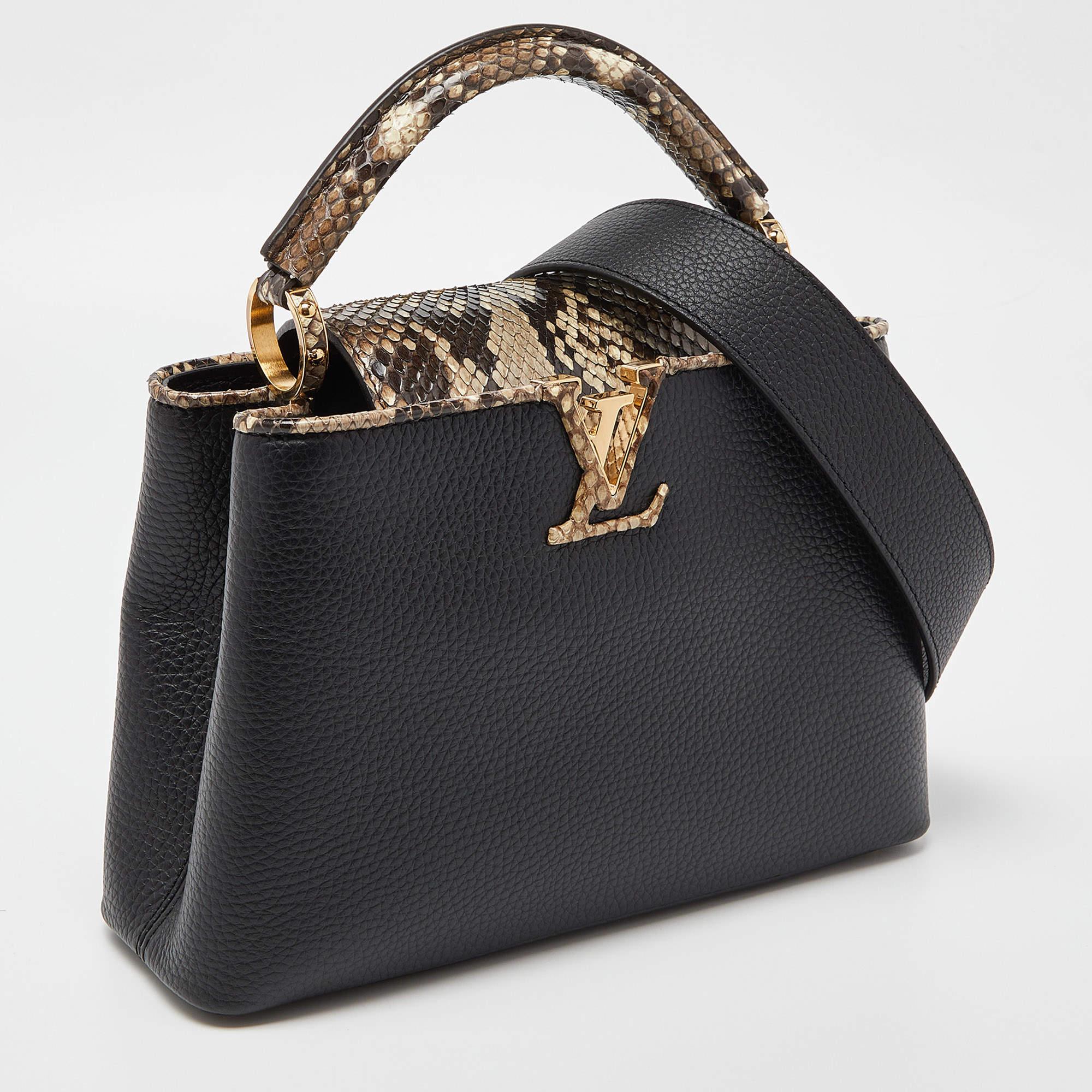 Your closet will always have space for this Louis Vuitton handbag as appealing as this one. Crafted from Taurillon leather, this Capucines BB bag features a structured design with a single python leather handle and protective metal feet. While the