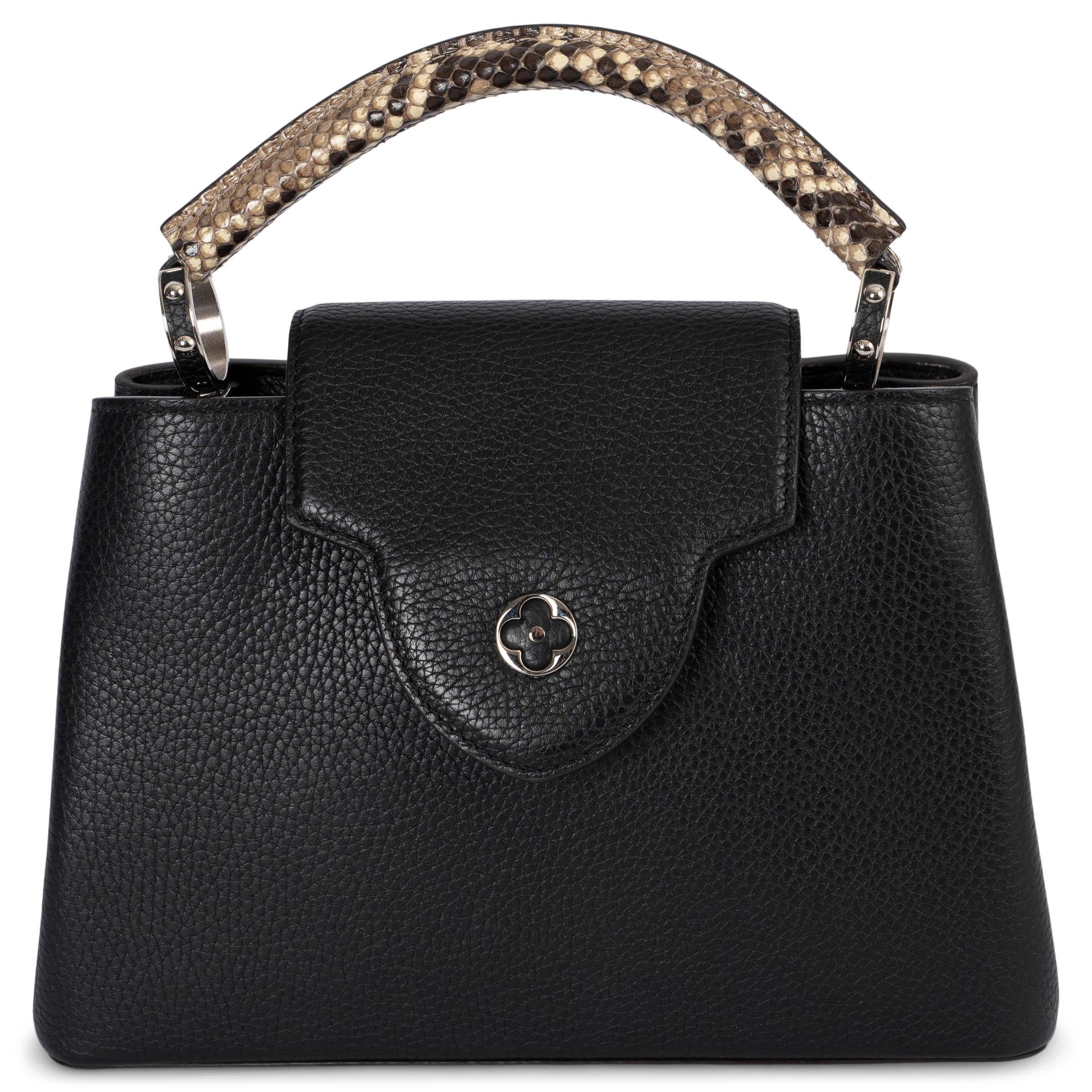 100% authentic Louis Vuitton Capucines MM bag in black full-grain Taurillon leather, it features a distinctive flap which can be worn two ways: outside to reveal a Monogram Flower, or inside to display the leather-wrapped LV Initials. This elevated