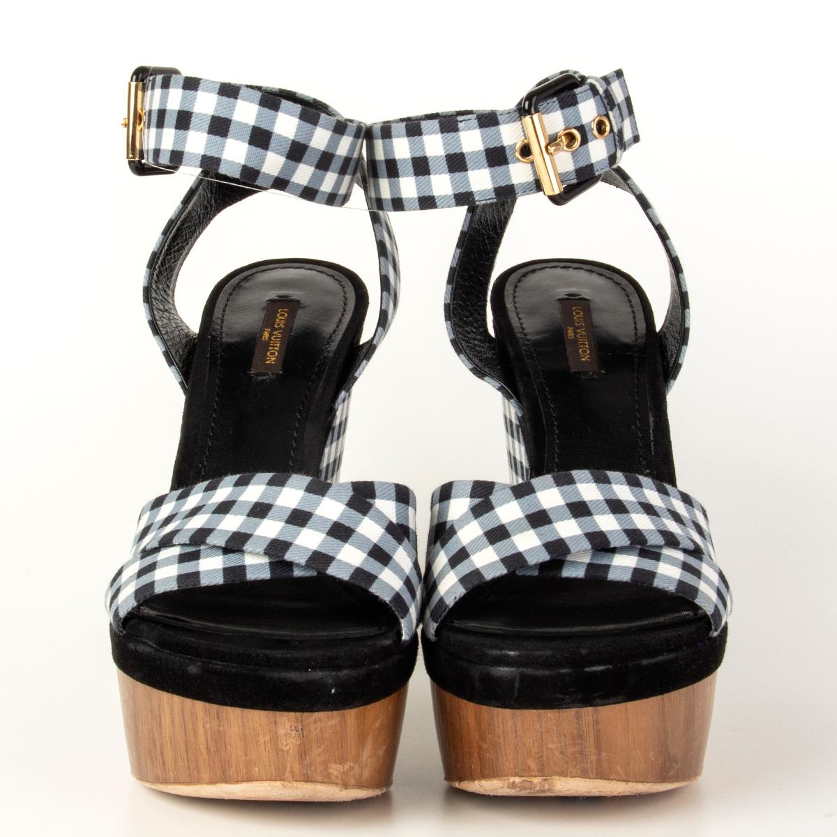 100% authentic Louis Vuitton gingham wedge sandals designed with blue and white gingham check straps with ankle-strap buckle fastening featuring wooden platform front and combination of a wedge and clog heel. Have been worn with a dent on the left
