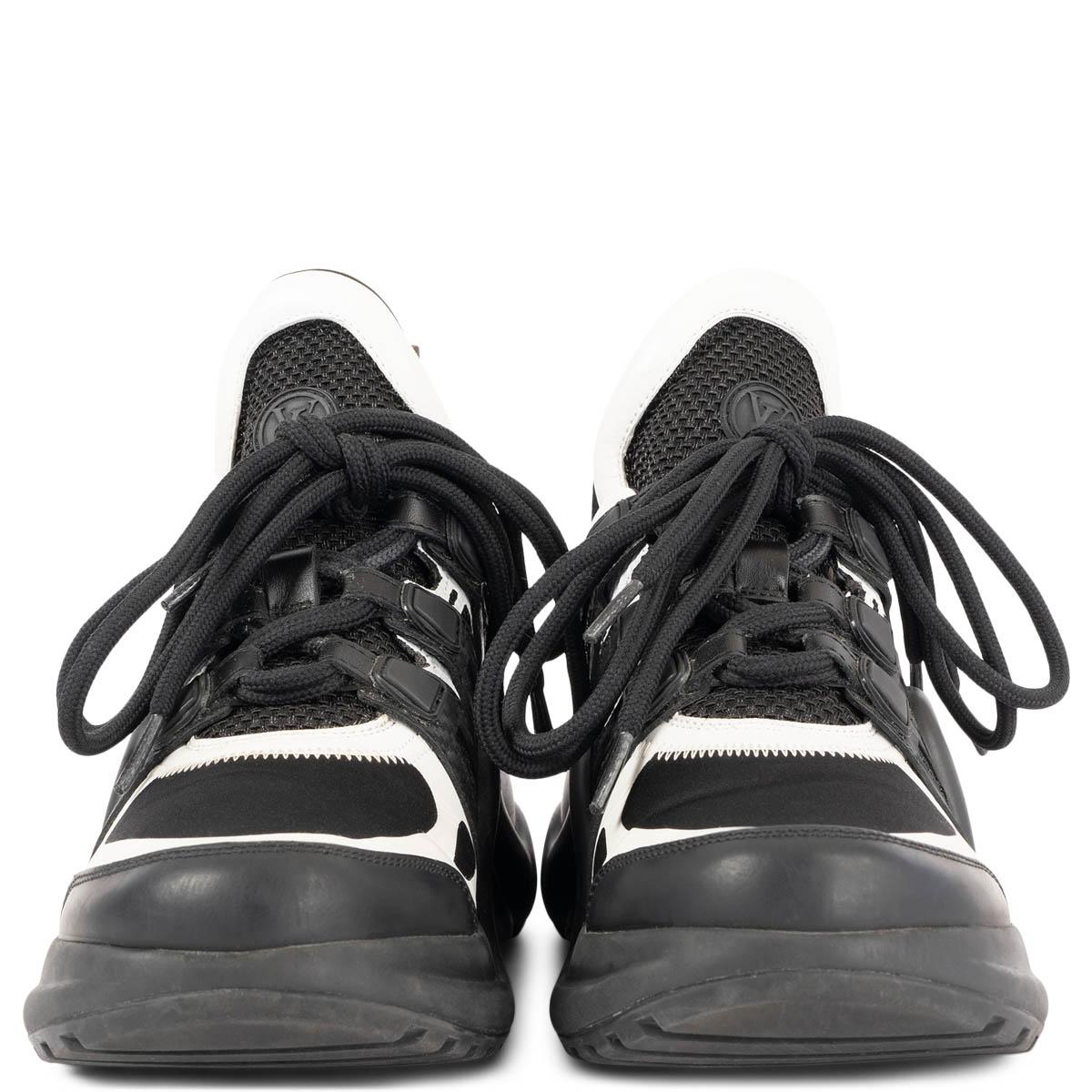 100% authentic Louis Vuitton Archlight sneakers in black mesh and technical fabric with white leather trimming. This sneaker is characterized by its oversized tongue and turbo outsole, which discreetly adds extra height. Monogram canvas pull sling