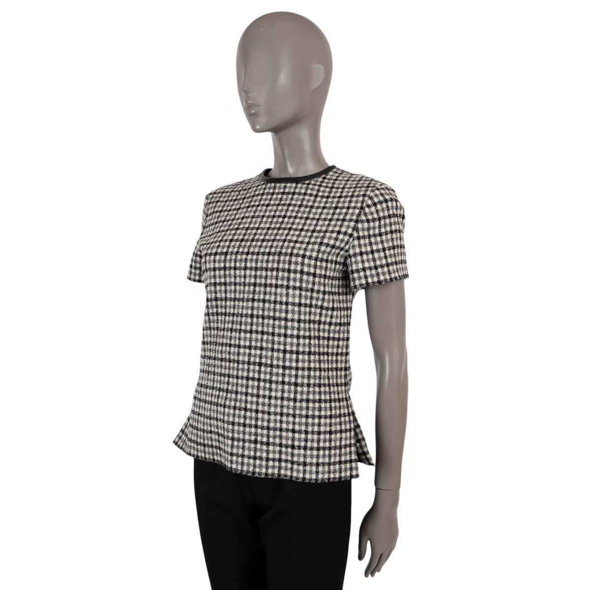 100% authentic Louis Vuitton leather trim check shirt in black, white and gray wool (100%- please note the content tag is missing). Opens withe a black zipper on the back. Lined in silk (100%). Has been worn and is in excellent condition.