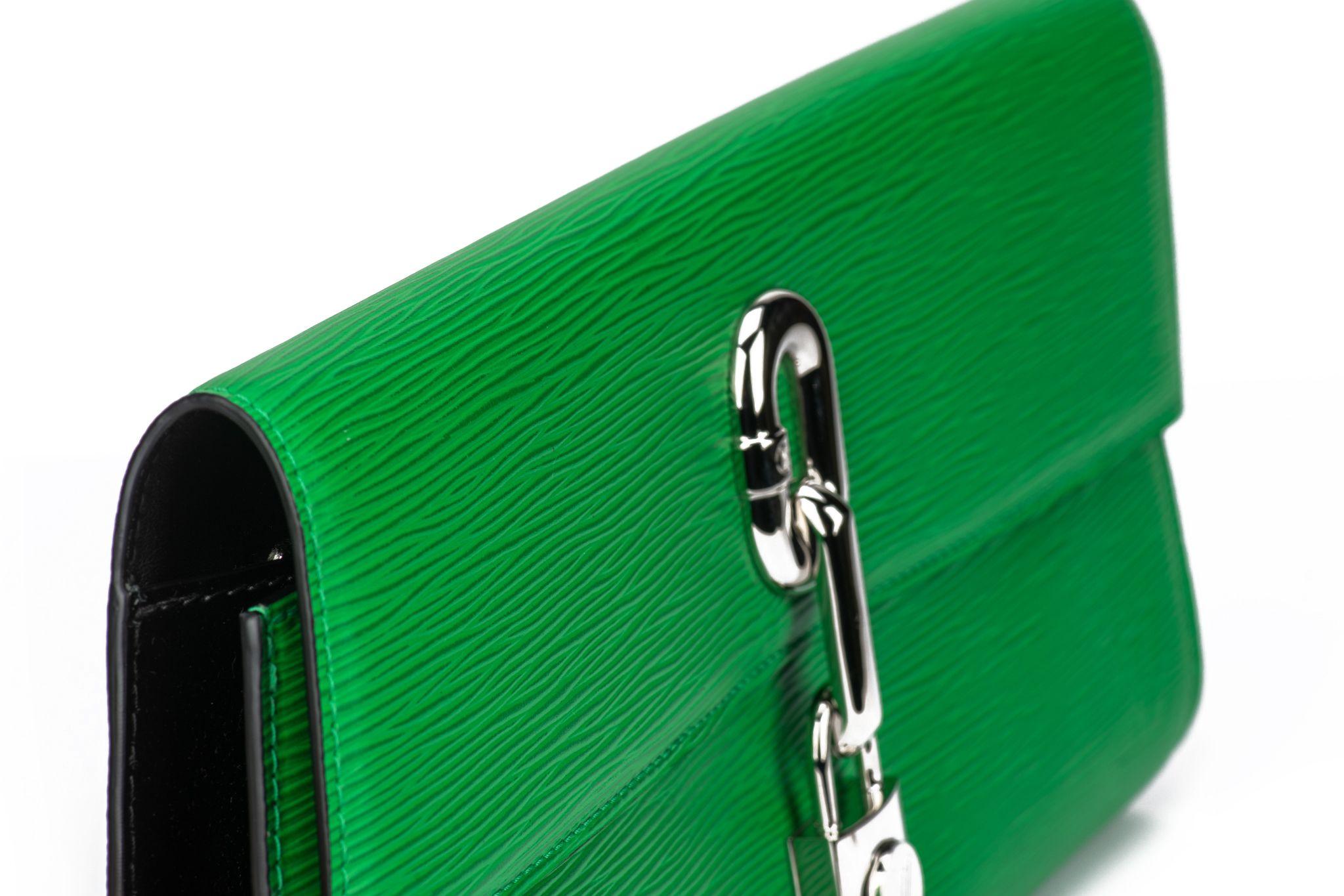 Louis Vuitton Blade clutch made of epi leather in a bright green. Palladium logo hardware. The clutch is new and comes with original dustcover.