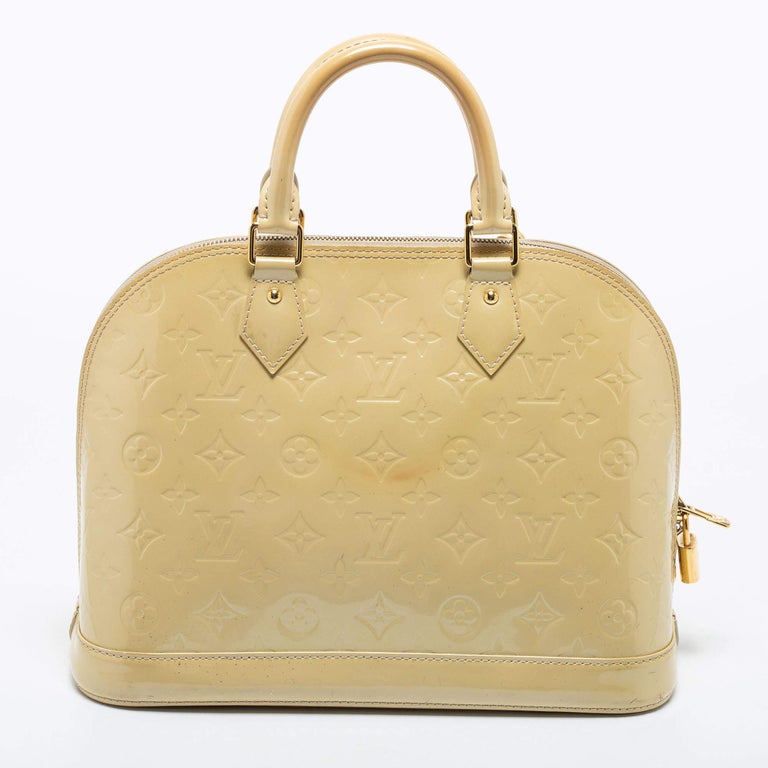 From one of the most iconic collections of Louis Vuitton, this Alma bag is imbued with exquisite craftsmanship and historic details. Constructed from Blanc Corail Monogram Vernis, it displays dual top handles and gold-tone hardware. The fabric-lined