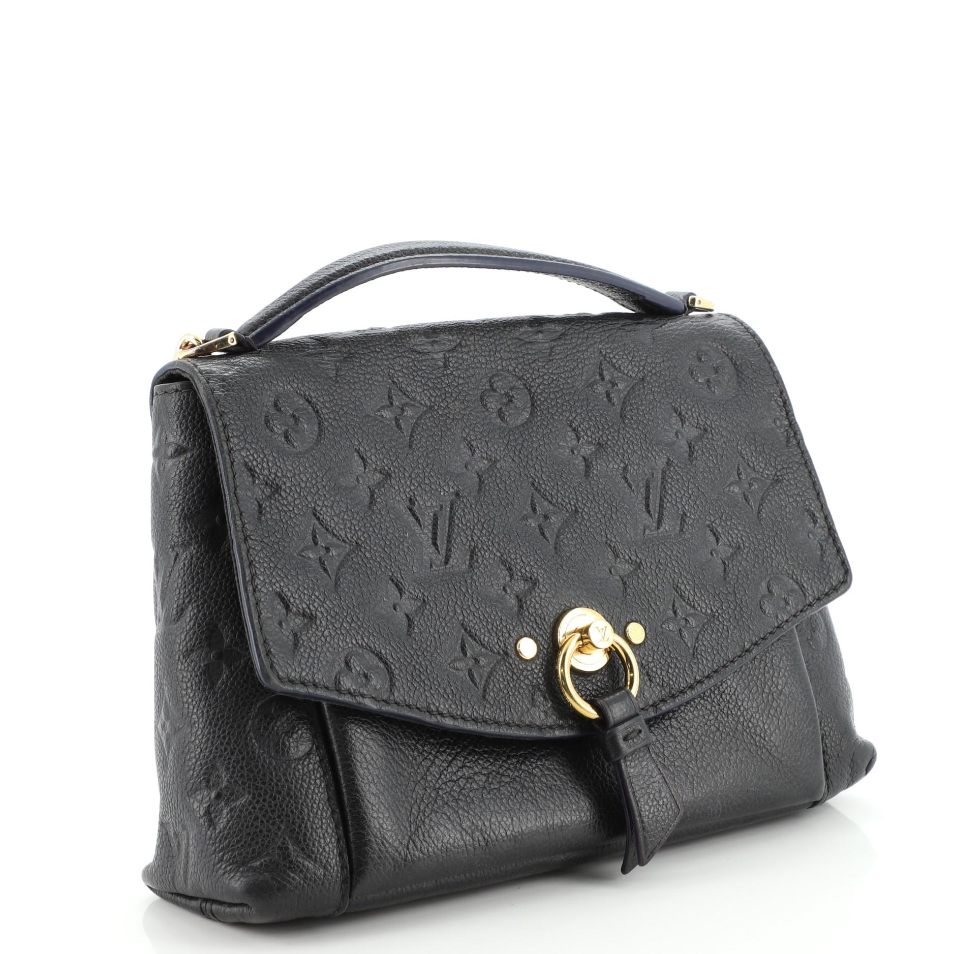 Condition: Fair. Odor in interior. Creasing, moderate wear and scuffs on exterior, handle and strap, heavy wear on base corners, heavy melting and peeling on side flap and strap wax edges. Heavy wear, discoloration and stains underneath flap and in