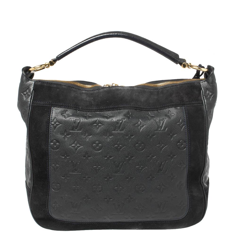 A practical and stylish creation from the house of Louis Vuitton, the Audacieuse seizes the essence of everyday elegance. A unique combination of suede and embossed Empreinte leather in thick panels, along with gold-tone hardware, make this