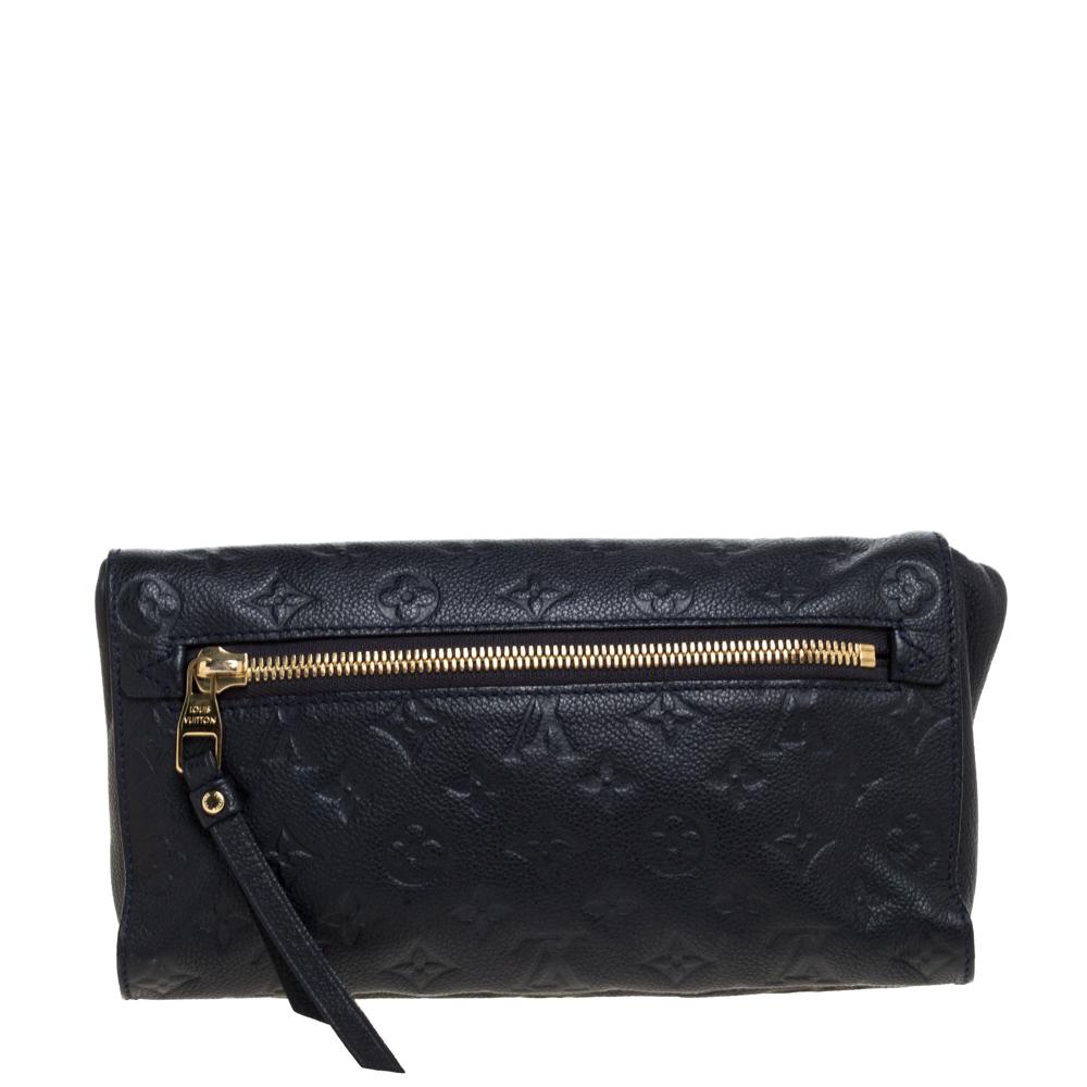 Complete your look with this chic and cool Louis Vuitton Petillante clutch. Artistically crafted from Monogram Empreinte leather, this clutch has dual zip pockets on the exterior, one on the front and the other on the rear. It has a comfy interior