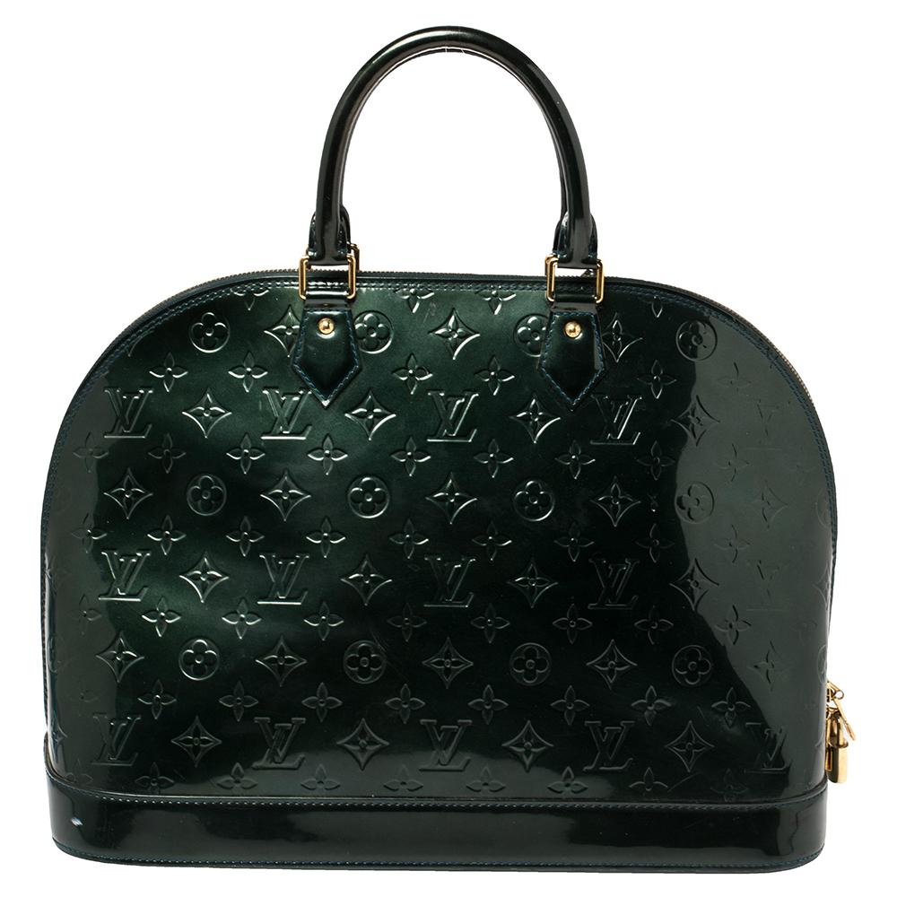 Out of all the irresistible handbags from Louis Vuitton, the Alma is the most structured one. First introduced in 1934 by Gaston-Louis Vuitton, the Alma is a classic that has received love from icons. This piece comes crafted from Monogram Vernis,