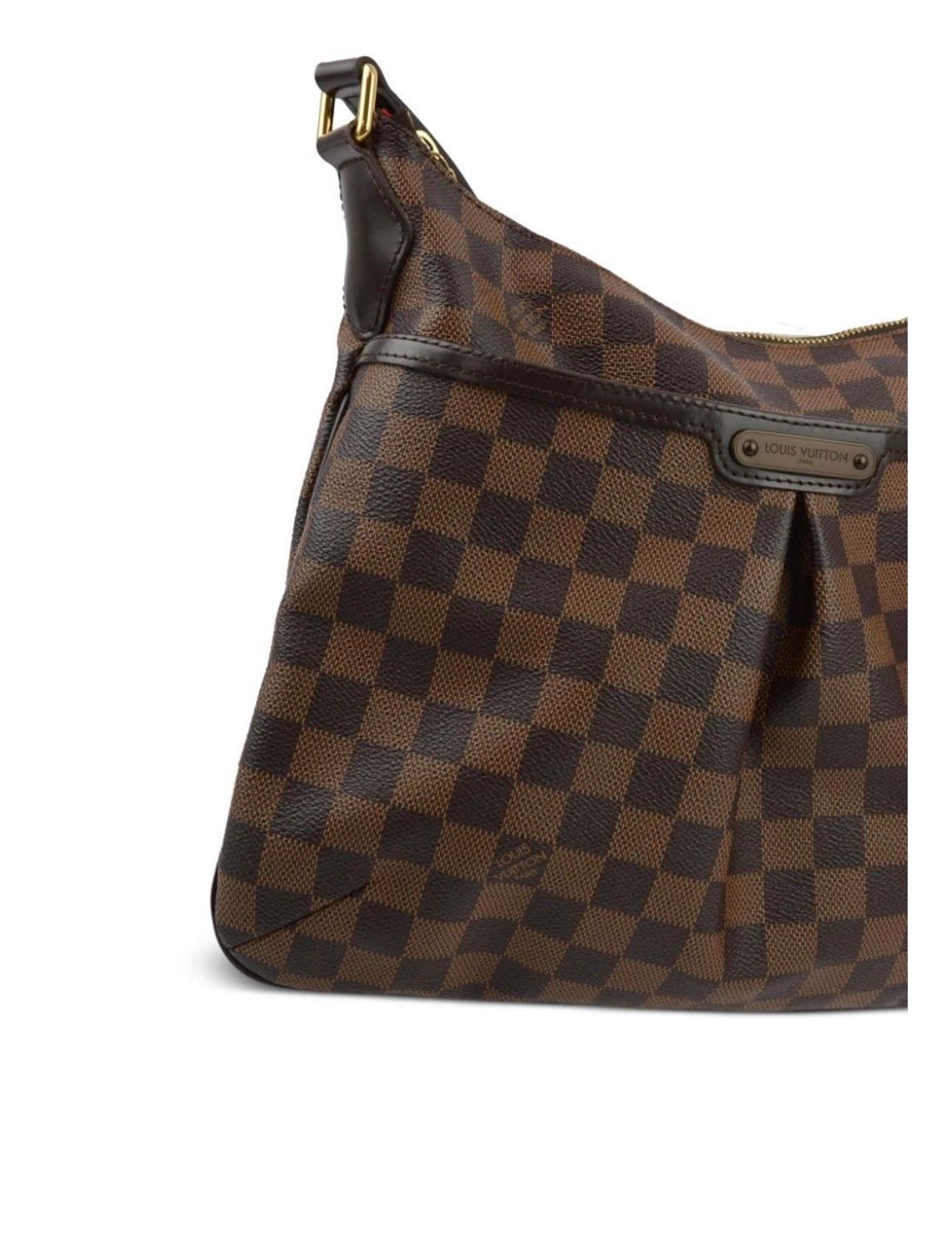 Louis Vuitton Bloomsbury PM Damier Ebene Canvas Crossbody Bag
Adjustable crossbody strap
Top zip closure
Goldtone hardware
Outside slip pocket
Inside slip pocket
LXR authenticity card included
Date code: SP5018
Lined
Leather trim
Coated canvas
Made