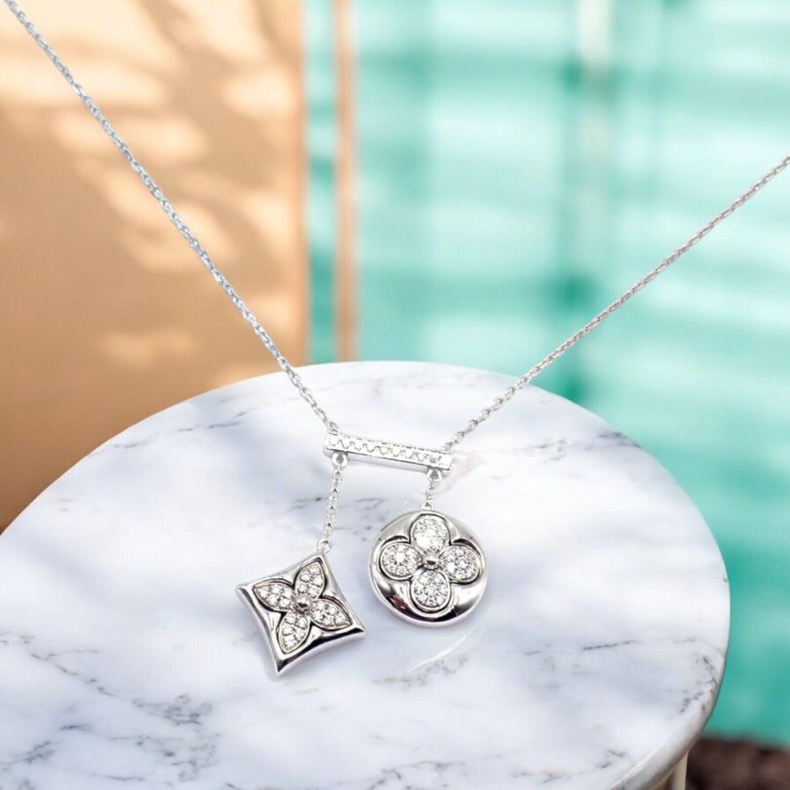 18k White Gold Blossom Diamond Pendant Link Necklace by Louis Vuitton. 
The Louis Vuitton Blossom pendant necklace radiates elegance with its 18k white gold craftsmanship. 
Featuring the iconic flower motif adorned with dazzling diamonds, it