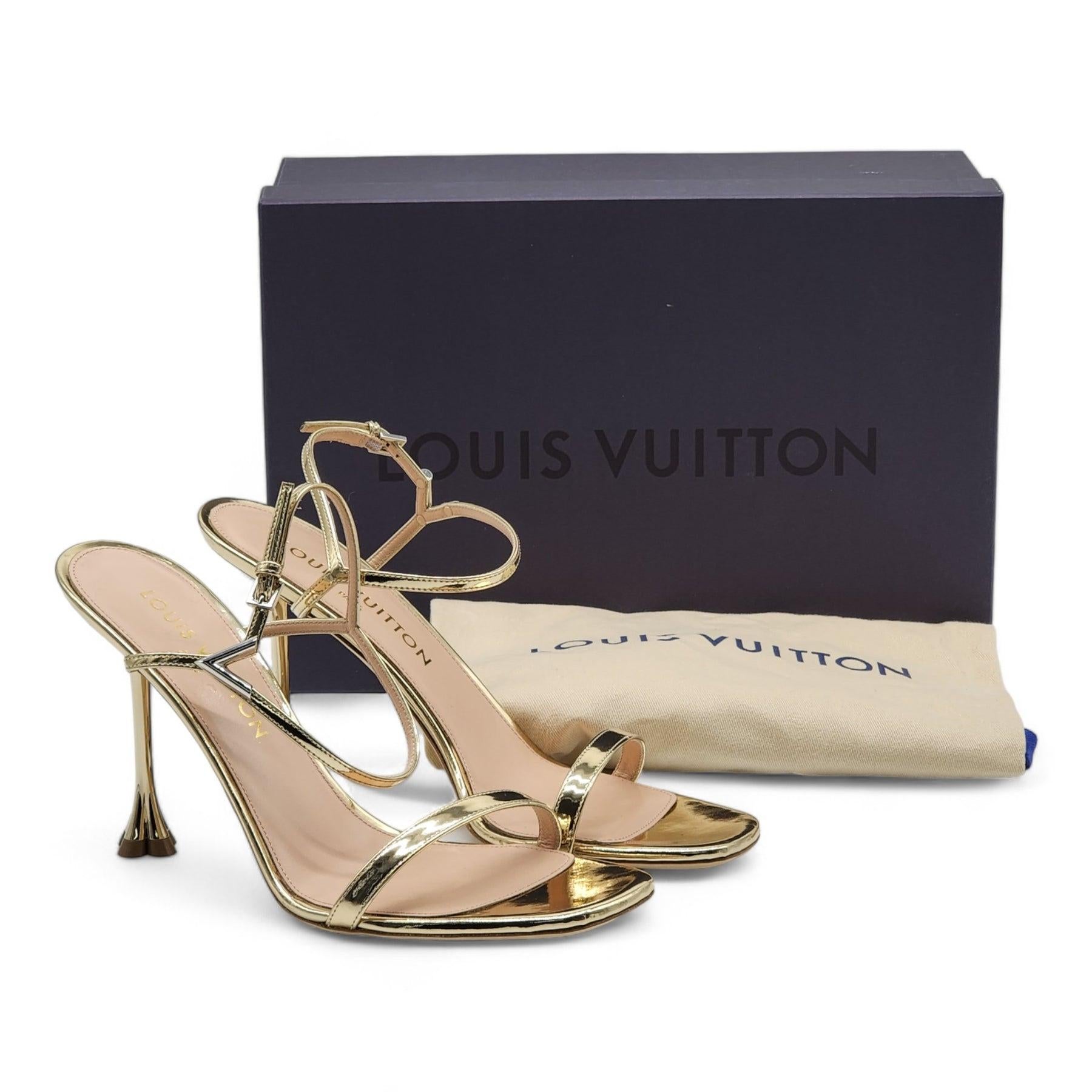 Gold. 
Metallic calf leather. 
Leather outsole. 
9.5 cm / 3.7-inch heel. 
V accessory. 
Monogram Flower-shaped heel. 
Made in Italy. 

Condition:
Brand new with box.
