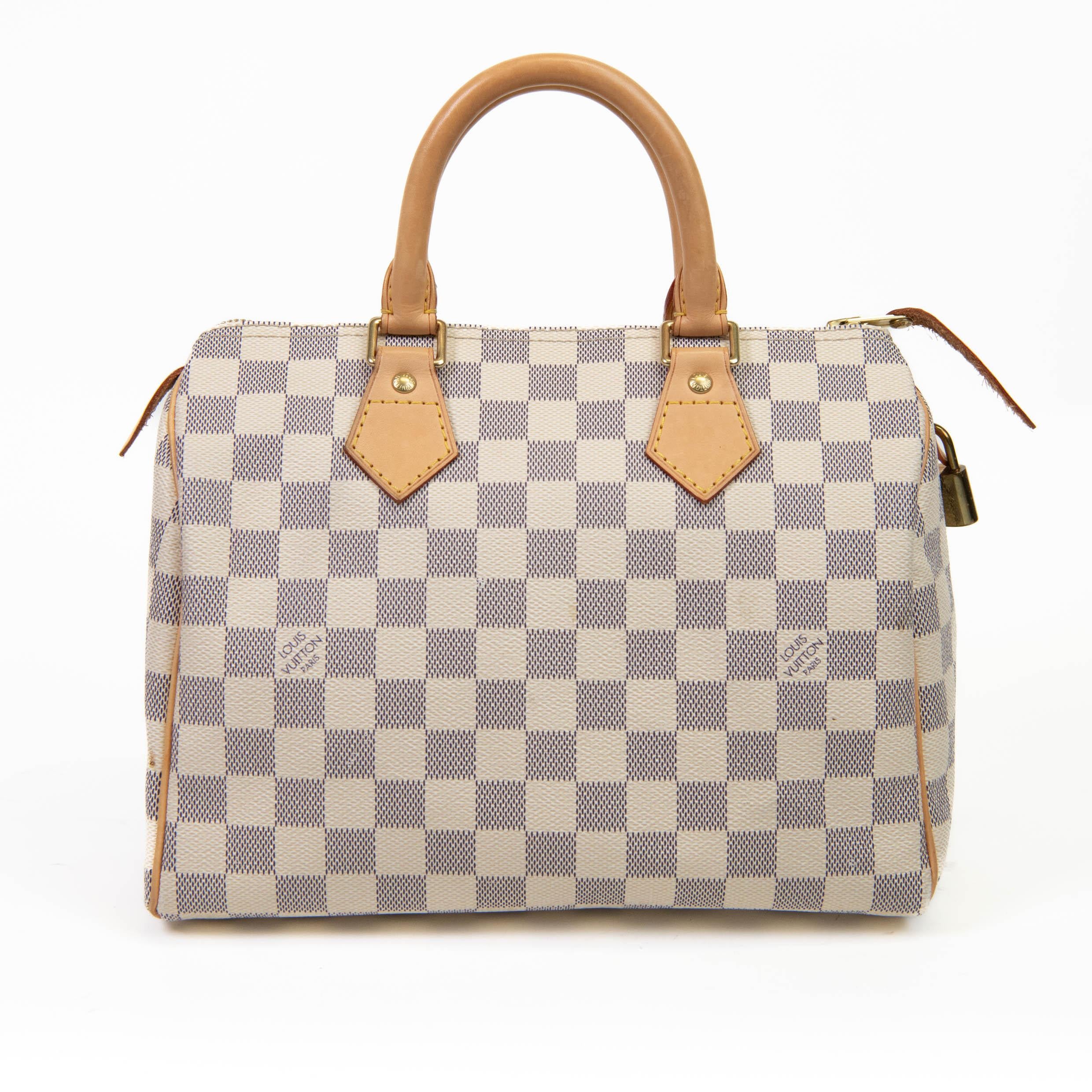 100% Authentic

This iconic tote is crafted of Louis Vuitton Damier checkered canvas in blue and white. The handbag features natural vachetta cowhide leather trim and rolled top handles with polished brass handle rings. The top zipper opens to a