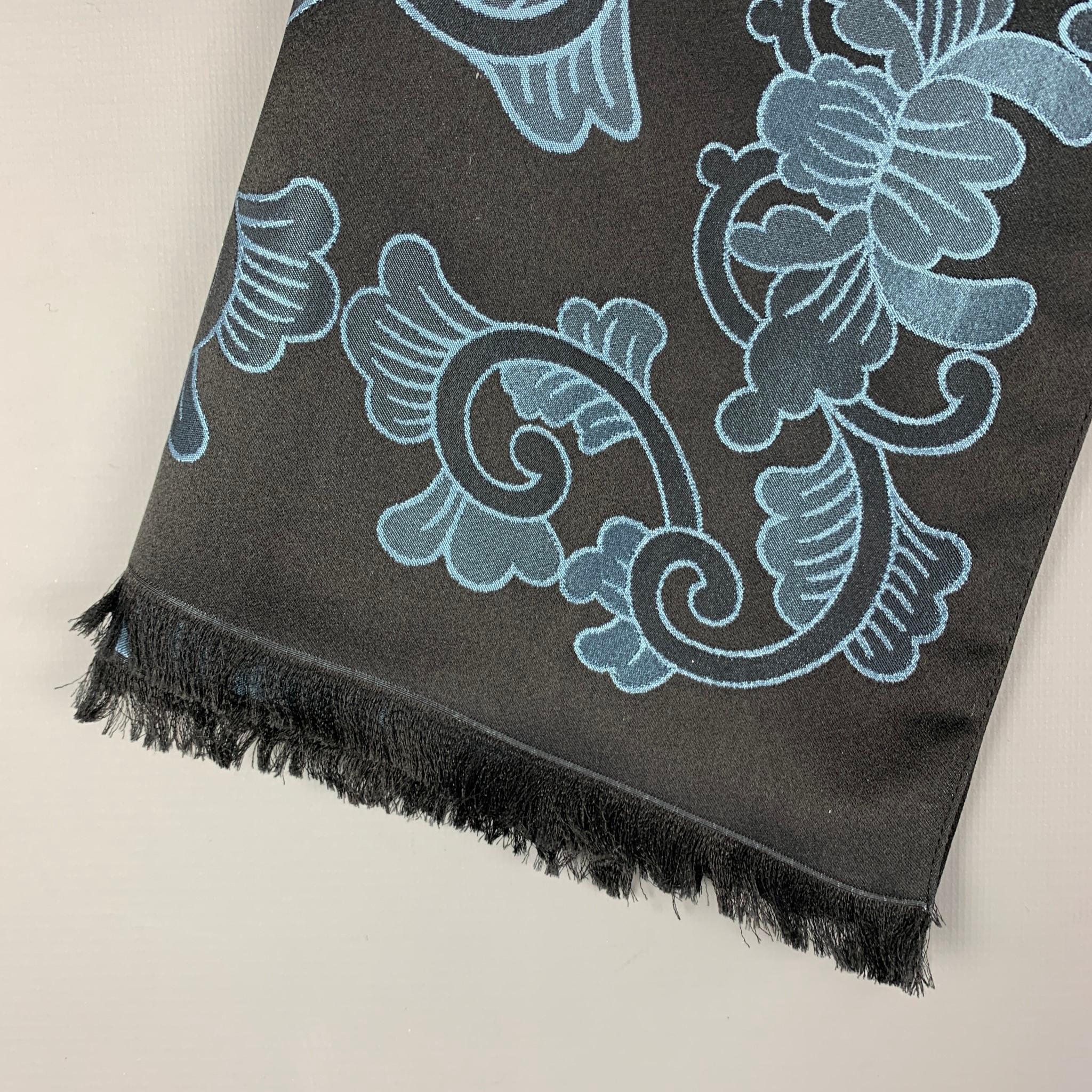 LOUIS VUITTON scarf comes in a blue & black jacquard silk featuring a fringe trim. Includes box. Made in Italy. 

Excellent Pre-Owned Condition.

Measurements:

68 in. x 26 in. 