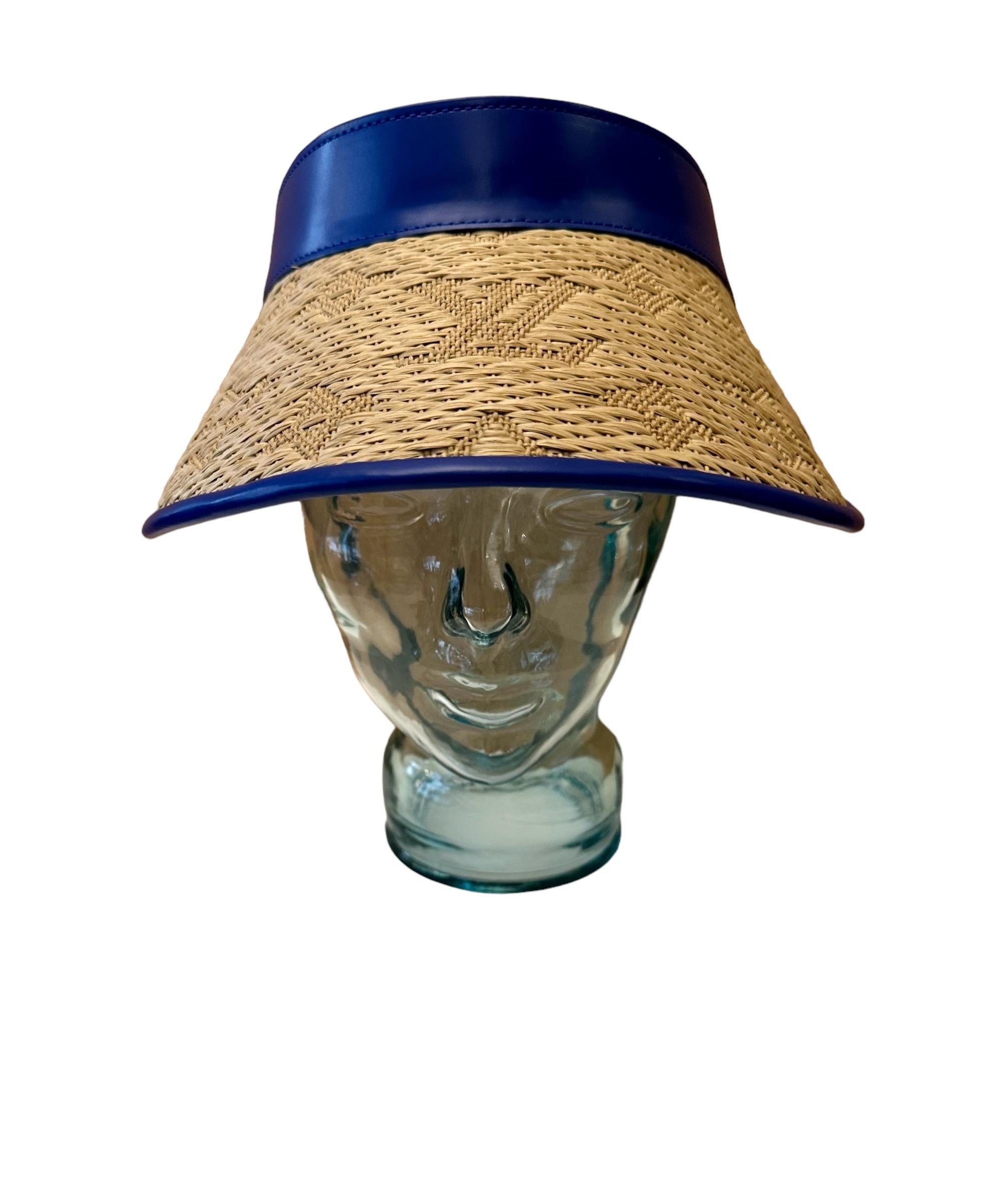 This pre-owned but new Louis Vuitton stawgram visor is a must for this summer ! 
It is made of raffia monogram and blue calf leather trim.
A snap closure at back with 3x allows 3 adjustable different sizes from 57cms to 59cms - approx. 22.44