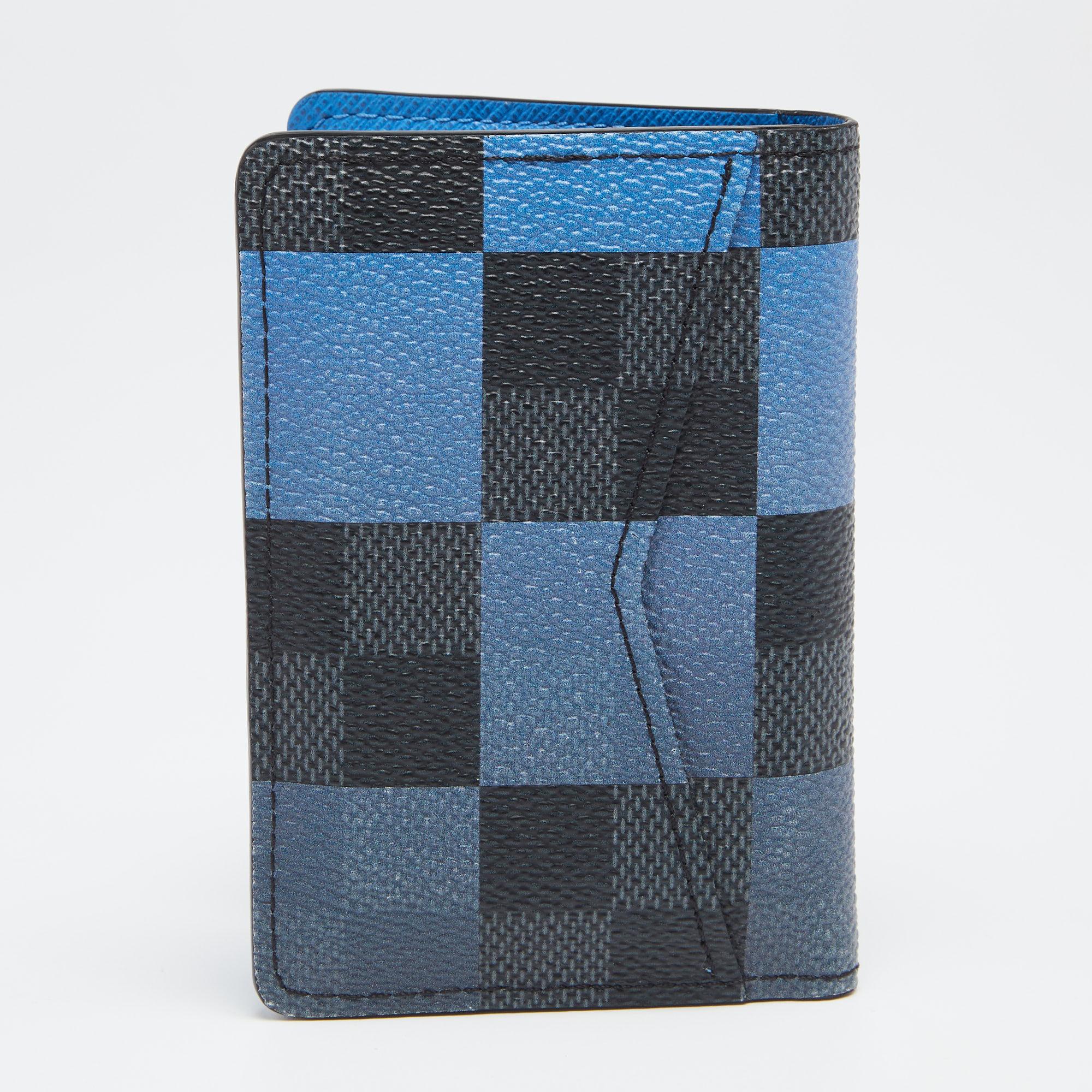 Designed to easily fit into your pockets and made from coated canvas with a touch of luxurious style, this blue pocket organizer from Louis Vuitton is a fine combination of practicality and high fashion.

Includes: Original Dustbag, Original Box