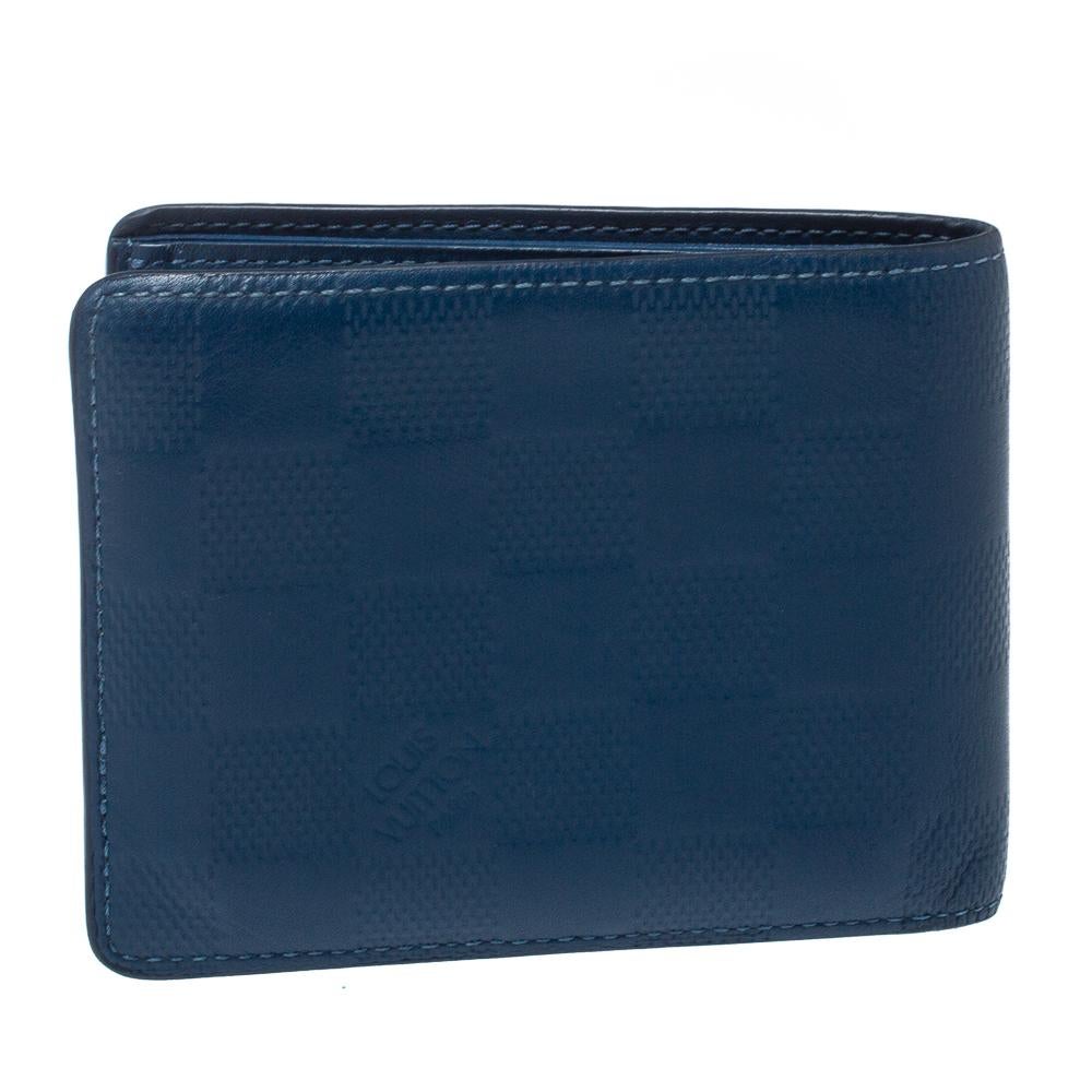 Wallets like this one from Louis Vuitton are a necessity since they're not only functional but also stylish. Crafted from blue Damier Infini leather, this wallet comes as a bi-fold. It has the iconic LV logo on the front and is equipped with