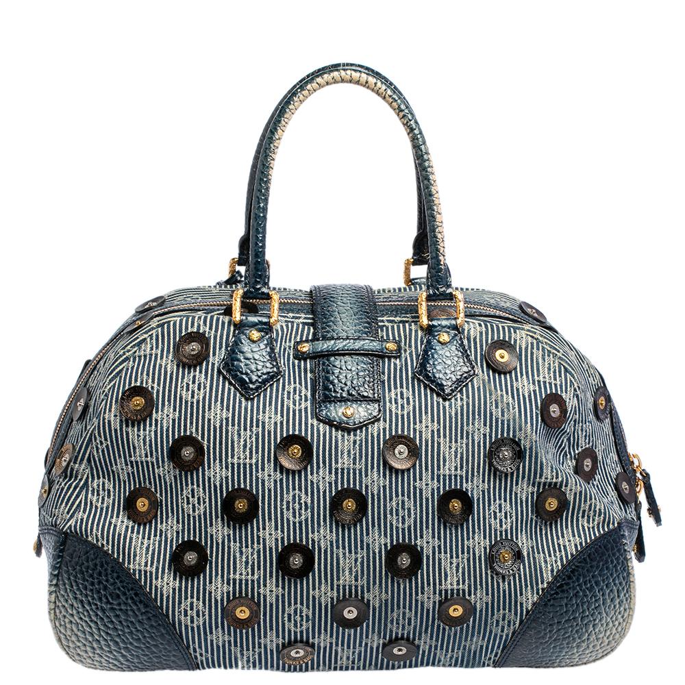 This Polka Dots Limited Edition Panema Bowly bag is by Louis Vuitton. A master in creating handbags that remain classic season after season, LV is a favored choice for an investment-worthy piece. Crafted from denim, this Panema Bowly bag has