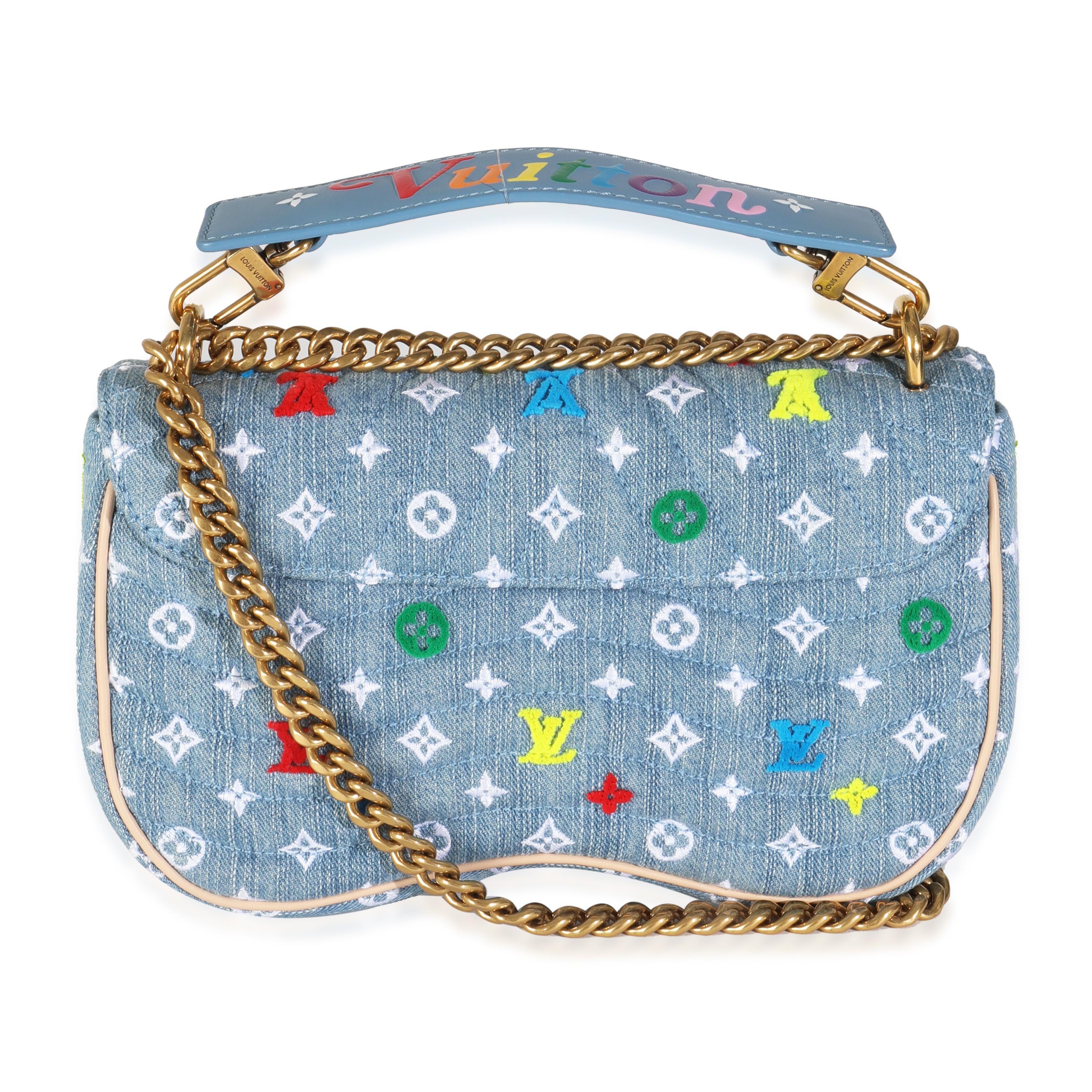 Listing Title: Louis Vuitton Blue Embroidered Monogram Denim New Wave MM
SKU: 144654
Condition: Pre-owned 
Condition Description: Make waves in the style department with the New Wave bag from Louis Vuitton. A chunky logo adorns the front, while