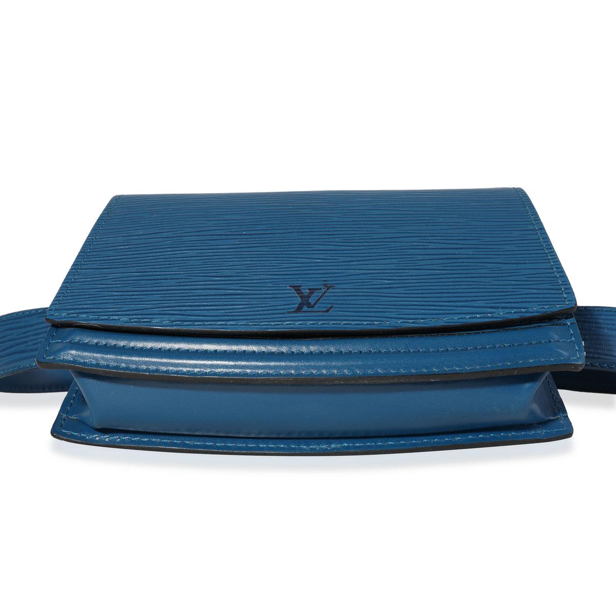 Louis Vuitton Blue Epi Leather Tilsit Belt Bag. Features gold hardware, a blue epi leather strap, blue leather interior and a flap closure.

77313MSC