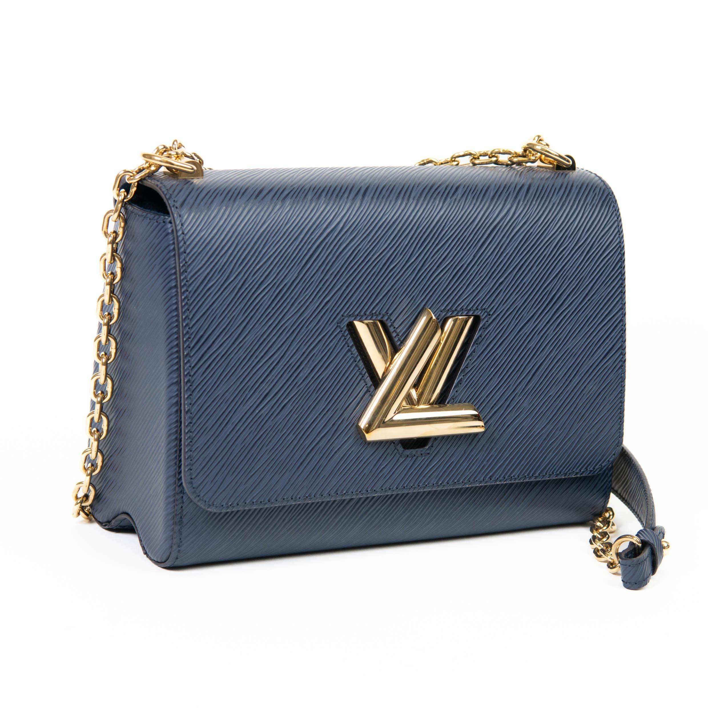 100% Authentic 

This stylish waist-length crossbody bag is crafted of textured epi leather in blue. The bag features a polished brass chain-link shoulder strap and a matching LV turn-lock on the facing flap. This opens to a dark blue microfiber