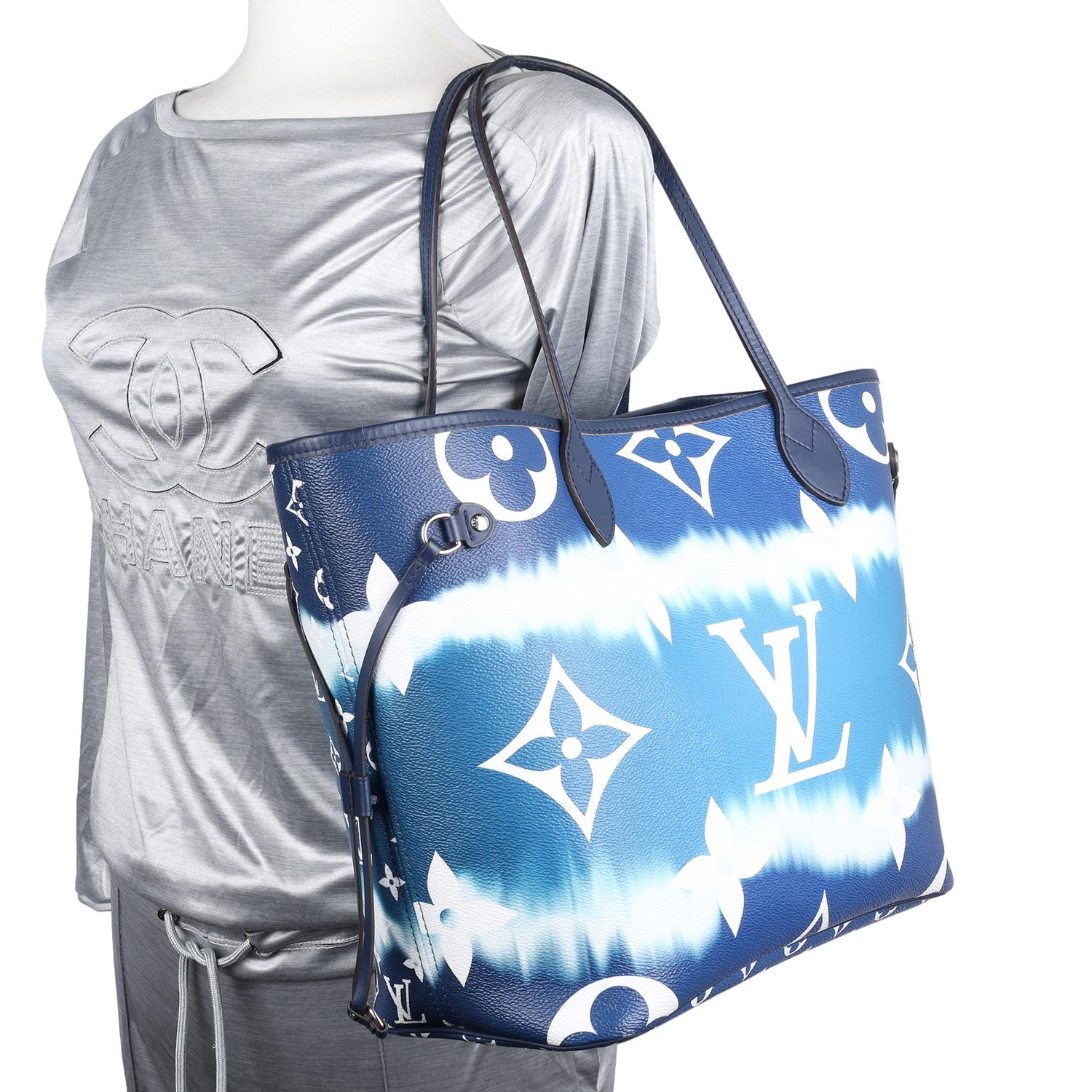 Authentic Escale Giant Neverfull MM Blue White Tie Dye Tote Handle Shoulder Bag. Features monogram canvas, leather trim and leather straps, textile interior lining with zipper slip pocket, silver hardware, leather straps for the hand, shoulder or