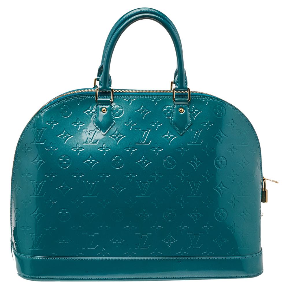 Out of all the irresistible handbags from Louis Vuitton, the Alma is the most structured one. First introduced in 1934 by Gaston-Louis Vuitton, the Alma is a classic that has received love from icons. This piece comes crafted from Monogram Vernis