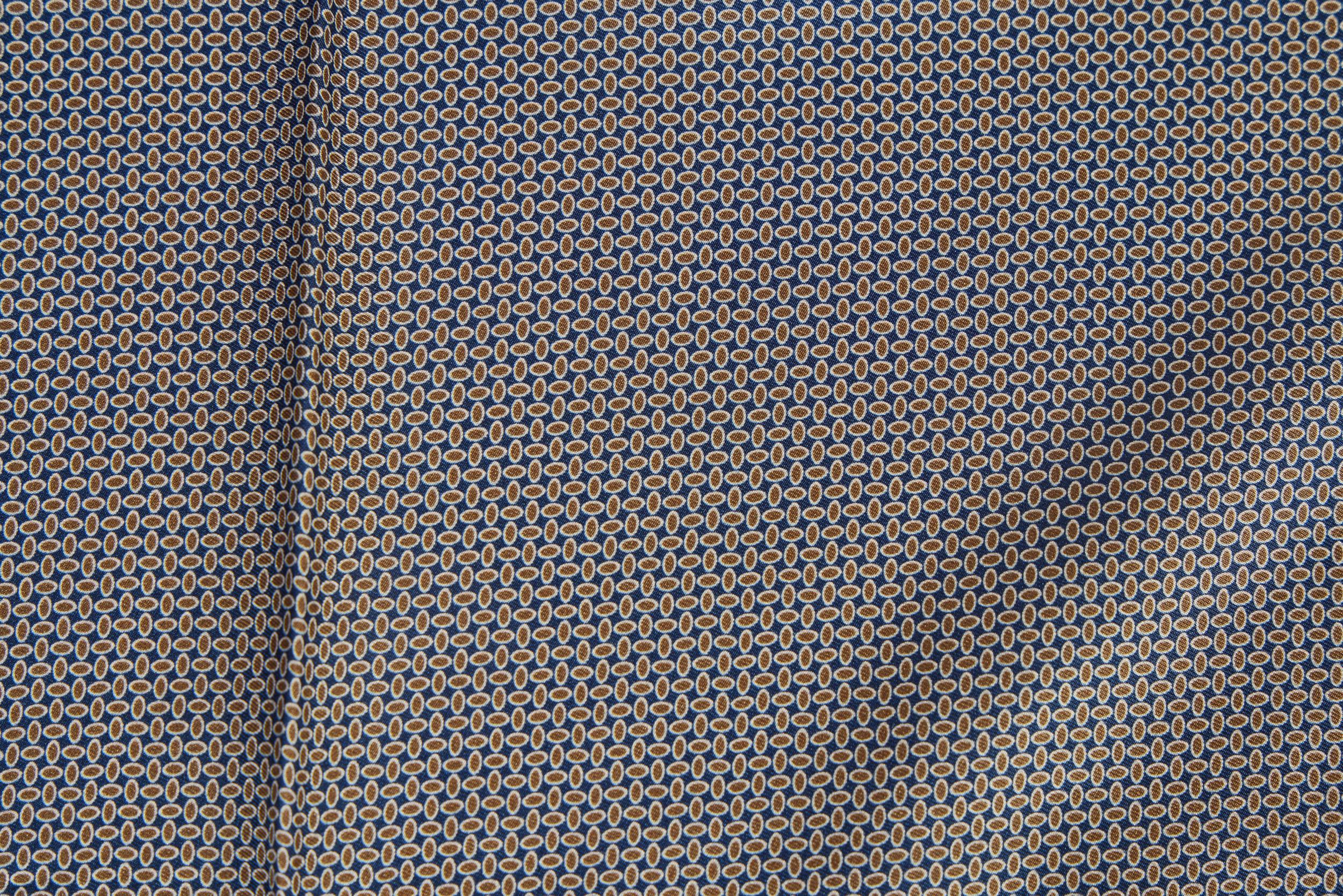 Louis Vuitton brand new silk pocket square in geometric blue and gold pattern . Hand rolled edges.