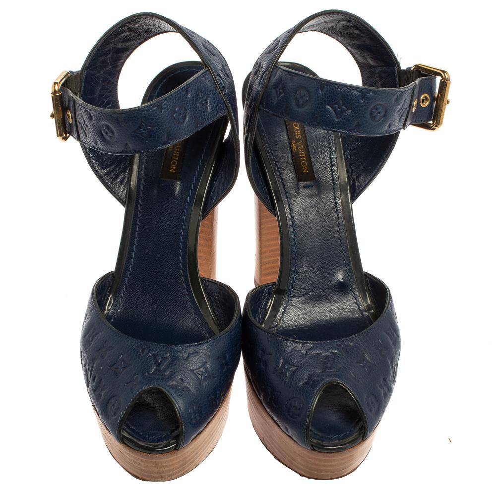 Beautifully designed and lovely to look at, this pair of sandals by Louis Vuitton will last you season after season. They are made from Infini Monogram Empreinte leather into a peep-toe silhouette and feature ankle fastenings and 13 cm heels