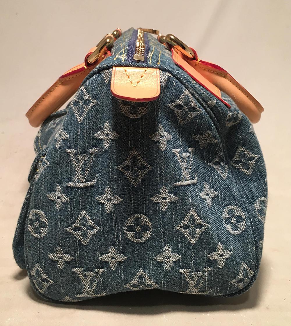 Louis Vuitton Denim Monogram Neo Speedy Handbag in excellent condition. Denim monogram woven exterior trimmed with gold hardware and tan leather trim. 2 front small latch flap pockets and one zippered pocket on front exterior side. Top zipper
