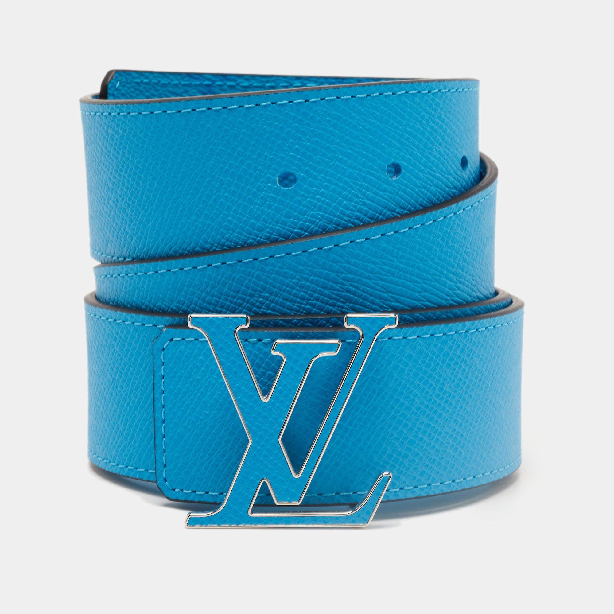 The LV Initiales belt is a stylish accessory from Louis Vuitton. Made from high-quality leather, it features a reversible design with the iconic LV monogram on one side and a solid color on the other. The belt is adjustable and showcases the brand's