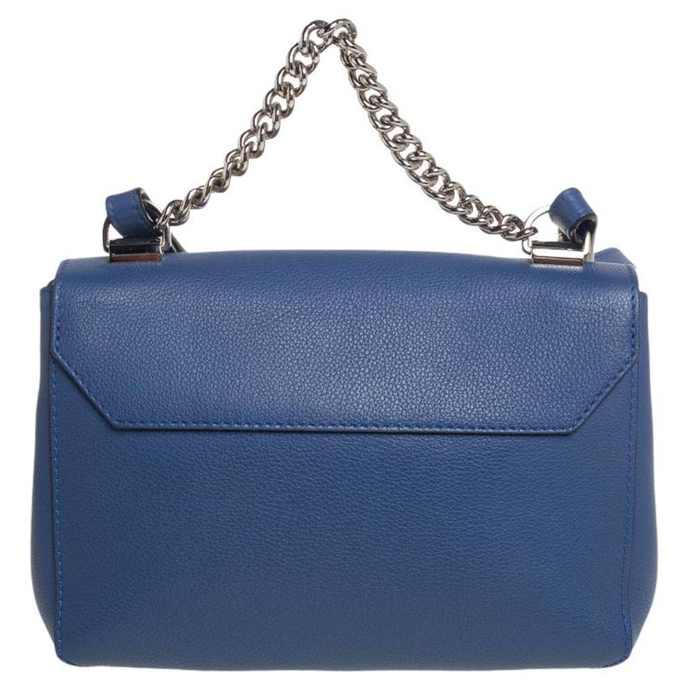 Bags are more than just instruments to carry one's essentials. They tell a woman's sense of style and Louis Vuitton brings you one such bag meticulously made from blue leather in a flap style with an LV turn lock on the front. This Lockme II BB bag