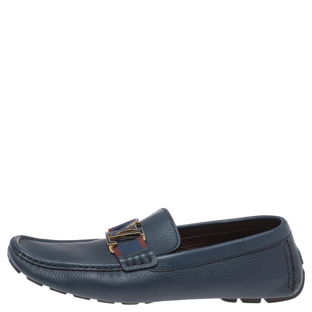 Look sharp and neat with this pair of Monte Carlo loafers from Louis Vuitton. They have been crafted from blue leather and designed with the art of fine stitching and the signature LV logo and ribbon straps on the uppers. The pair is complete with