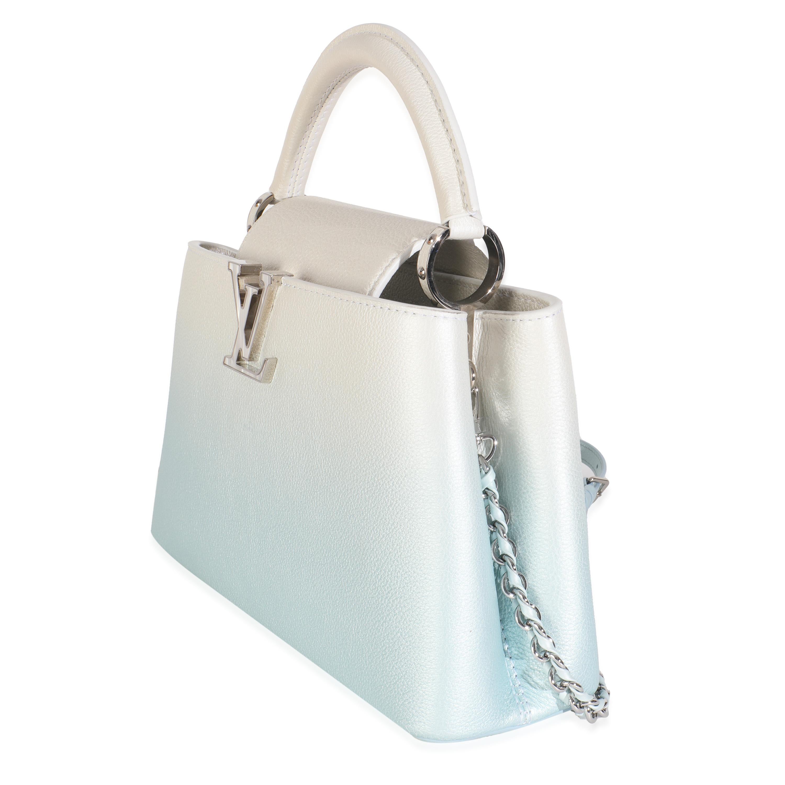 Listing Title: Louis Vuitton Blue Metallic Ombre Taurillon Capucines BB
SKU: Z148810
MSRP: 6850.00 USD
Condition: Pre-owned 
Condition Description: The Louis Vuitton Capucines bag was created with the brand's house codes in mind. Encapsulating the