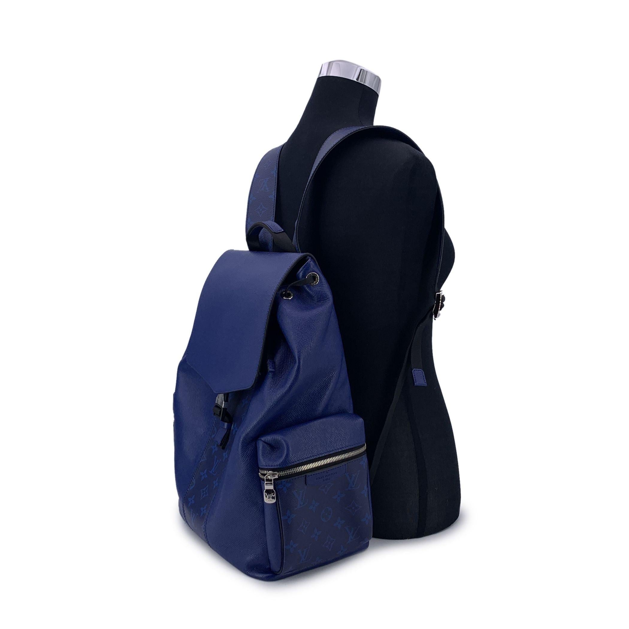 This beautiful Bag will come with a Certificate of Authenticity provided by Entrupy. The certificate will be provided at no further cost Louis Vuitton cobalt blue Taigarama leather 'Outdoor' unisex backpack bag, casual and sophisticated at the same