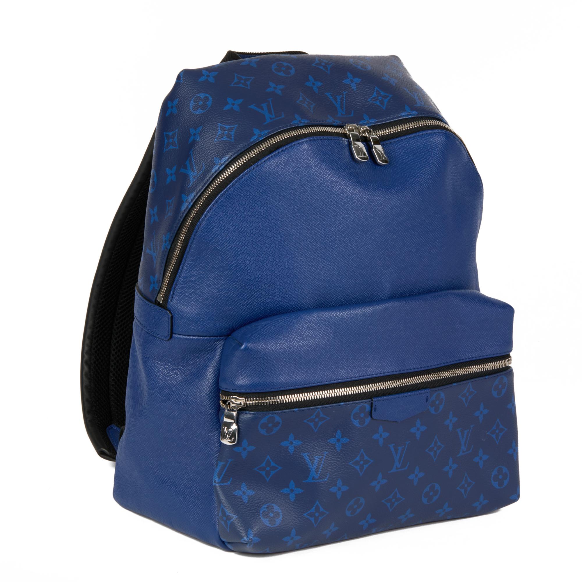 LOUIS VUITTON
Blue Monogram Coated Canvas & Taiga Leather Discovery Backpack PM

Xupes Reference: CB642
Serial Number: TJ0230
Age (Circa): 2000
Authenticity Details: Date Stamp (Made in France)
Gender: Gents
Type: Backpack

Colour: Blue
Hardware: