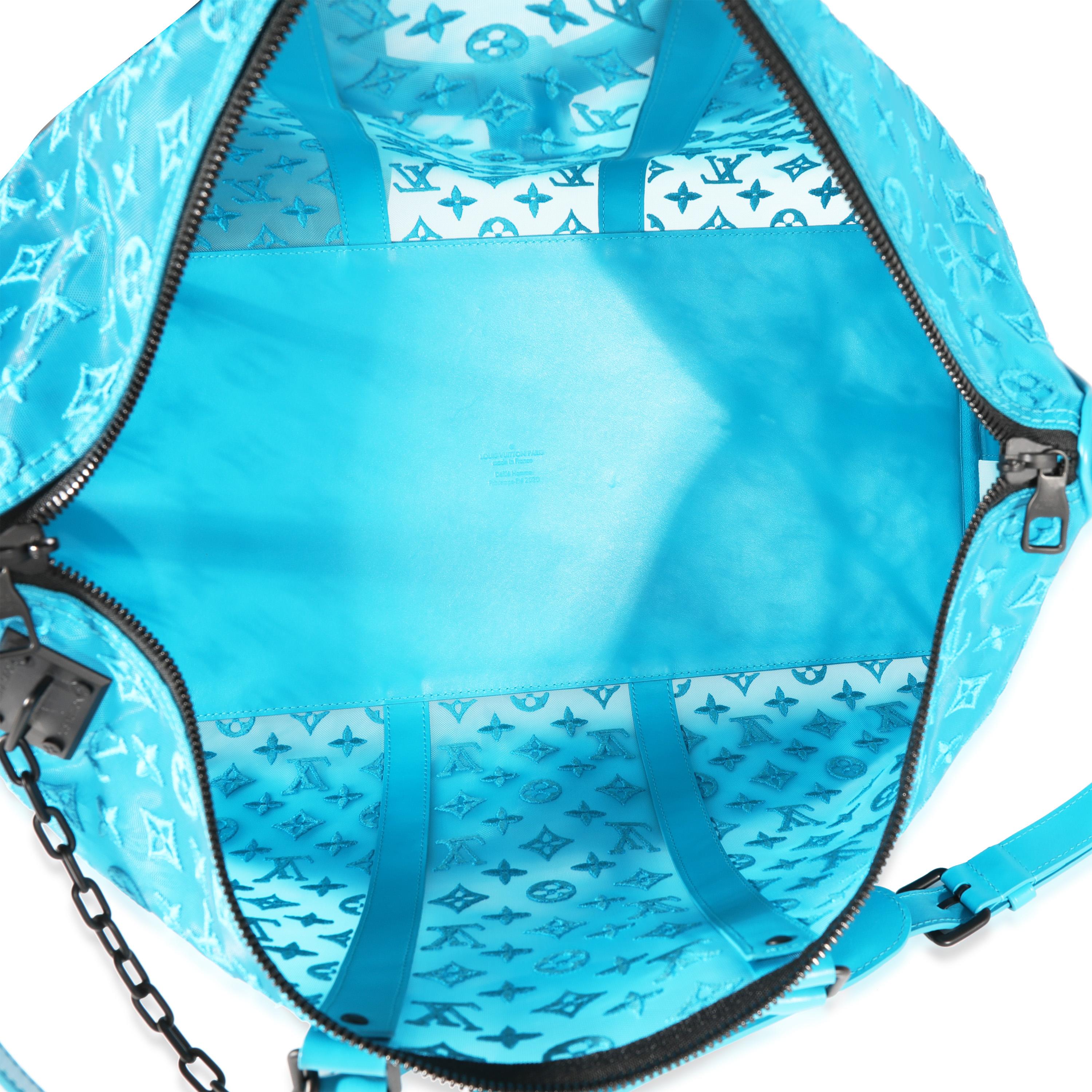 Listing Title: Louis Vuitton Blue Monogram Mesh Triangle Keepall Bandoulière 50
SKU: 122168
Condition: Pre-owned 
Handbag Condition: Excellent
Condition Comments: Excellent Condition. Scuffing at corners and at exterior. Light scratching at