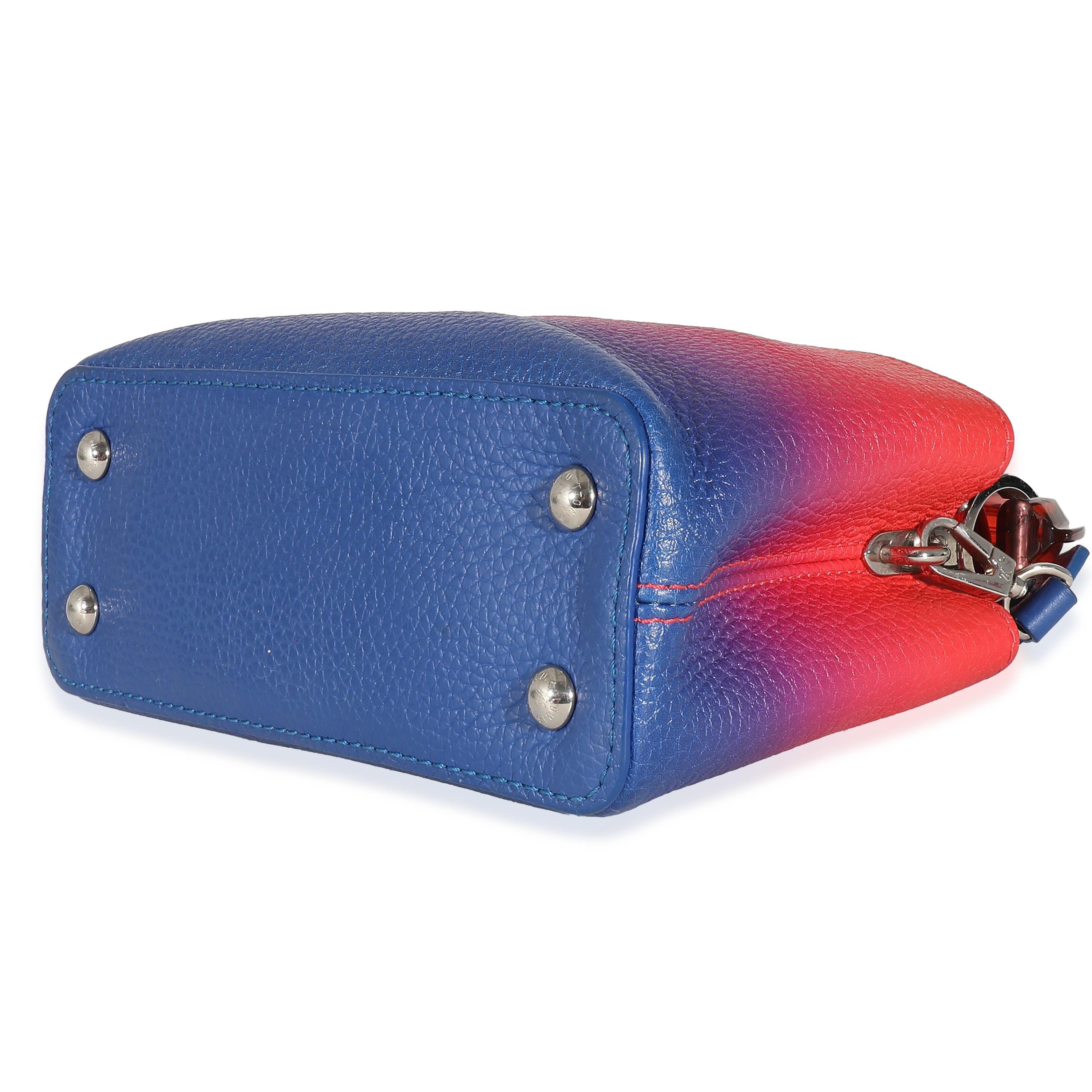 Listing Title: Louis Vuitton Blue Red Ombre Taurillon Mini Capucines
SKU: 137573
Condition: Pre-owned 
Condition Description: The Louis Vuitton Capucines bag was created with the brand's house codes in mind. Encapsulating the maison's DNA, the