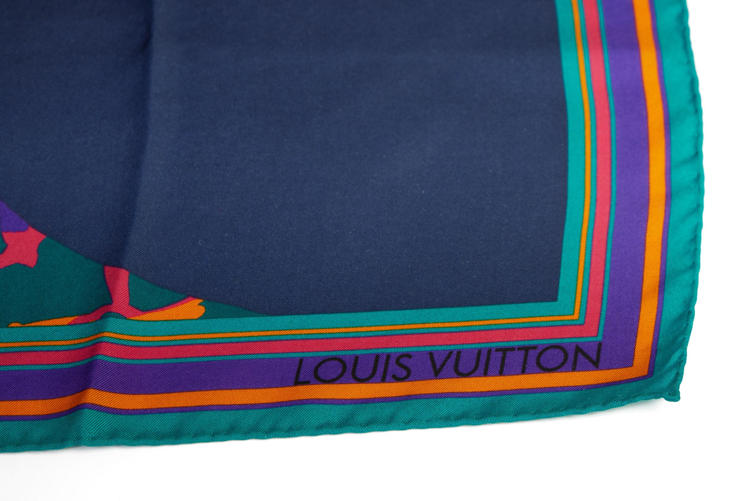 Louis Vuitton small silk scarf with giraffe design. Hand rolled edges.