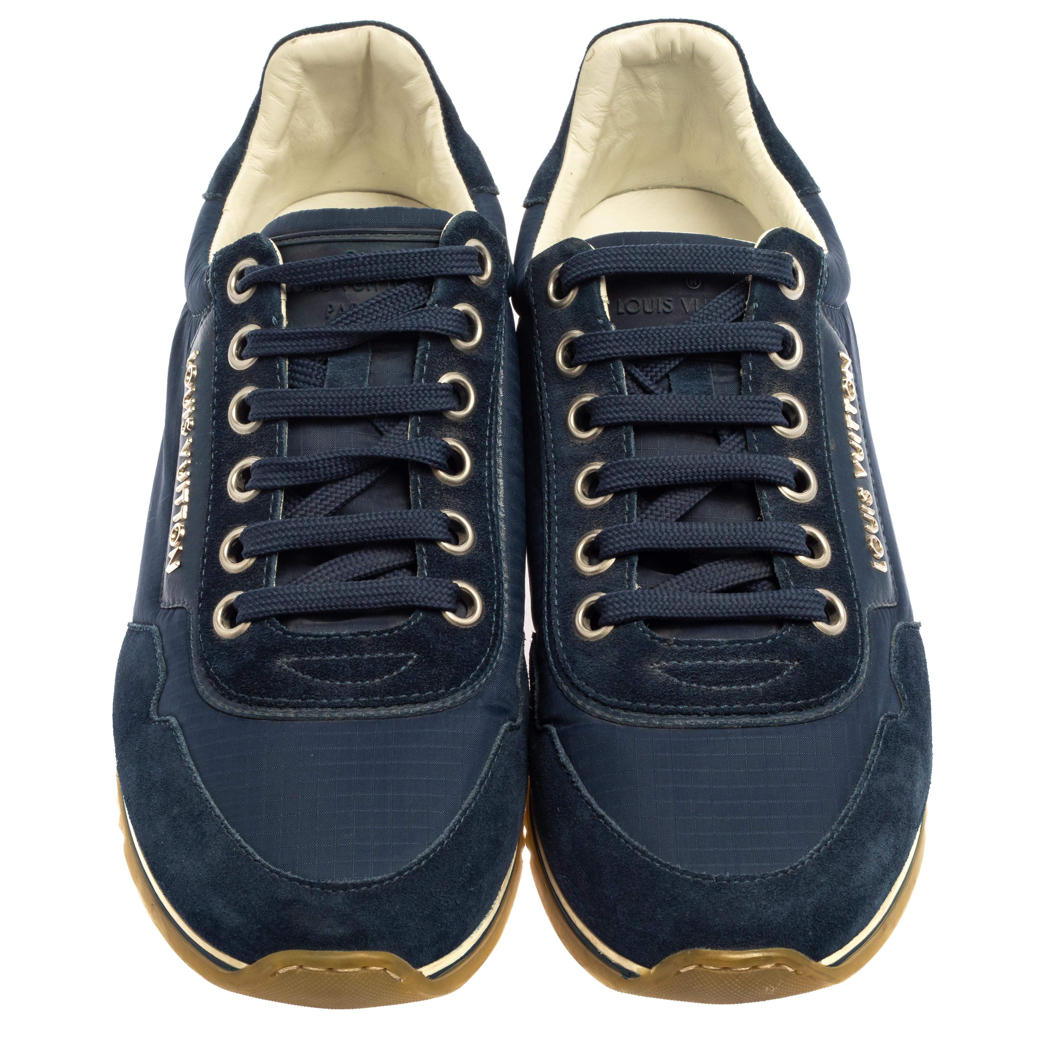 This classy and casual pair of low-top sneakers from Louis Vuitton is a must-have! They are made from plush suede & nylon and come in a lovely shade of blue. It flaunts the logo on the sides, lace-ups on the vamps, and is complete with rubber