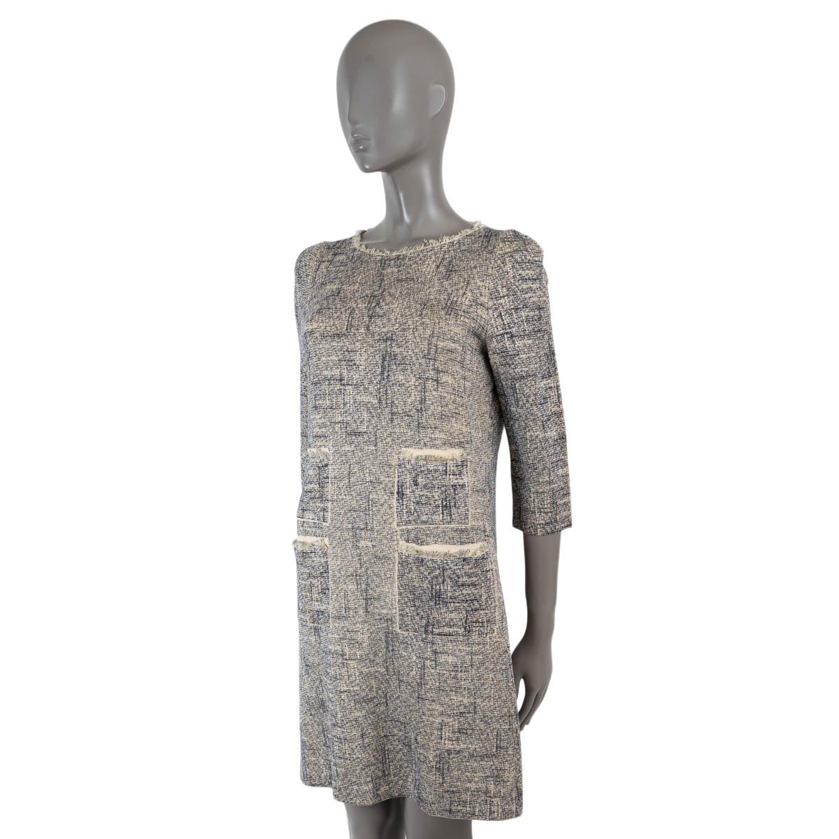 100% authentic Louis Vuitton knit dress in navy blue and white cotton (52%), silk (34%), polyamide (8%), tussah silk (5%) and elastane (1%). Features a round neck, four pockets and frayed edges. Unlined. Has been worn and is in excellent