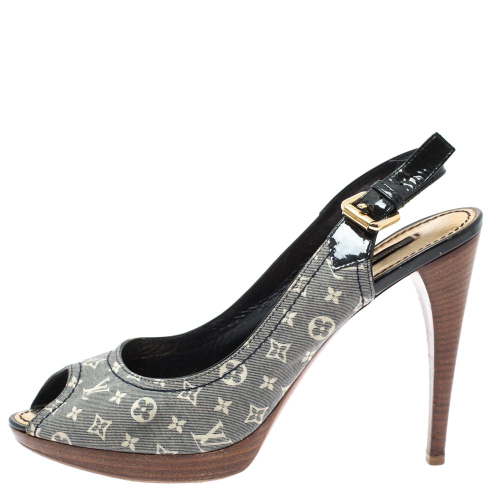 This pair of sandals from Louis Vuitton is a perfect example of exquisite designing. Flaunt style at its best with this beautiful pair made from Mini Lin monogram canvas and patent leather featuring peep toes and high 11.5 cm heels. Leather insoles