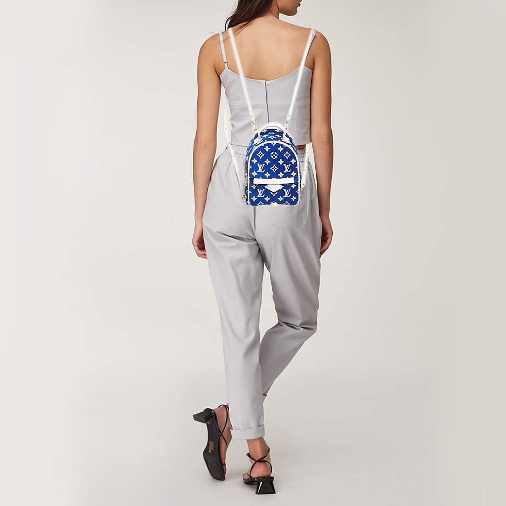 The Palm Springs backpack from Louis Vuitton is a practical staple and an on point city bag. This stylish creation is crafted from Monogram velvet and leather. The optional adjustable straps will provide a hands free carrying option.