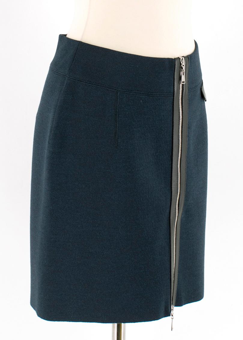 Louis Vuitton Blue Soft Wool Short Zip Up Skirt 

Soft wool, short blue skirt with black detailing,
One front left side pocket with snap button,
Front centre two zip fastening with iconic LV logo,
Elasticised waistband,
Soft black interior wool and