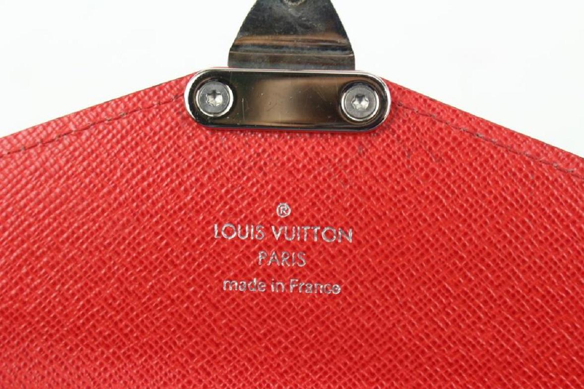 Louis Vuitton  Blue x Red Epi Tribal Mask Sarah Wallet 910lv100 In Good Condition For Sale In Dix hills, NY