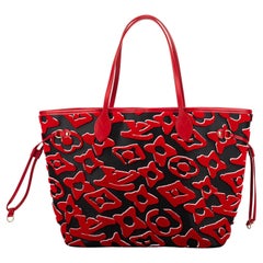 At Auction: Louis Vuitton, LOUIS VUITTON. Red URS Fisher pochette bag.  Black leather with red monograms. Short handle in red leather. Comes with dust  bag. Black interior. Zipper closure. In good condition.