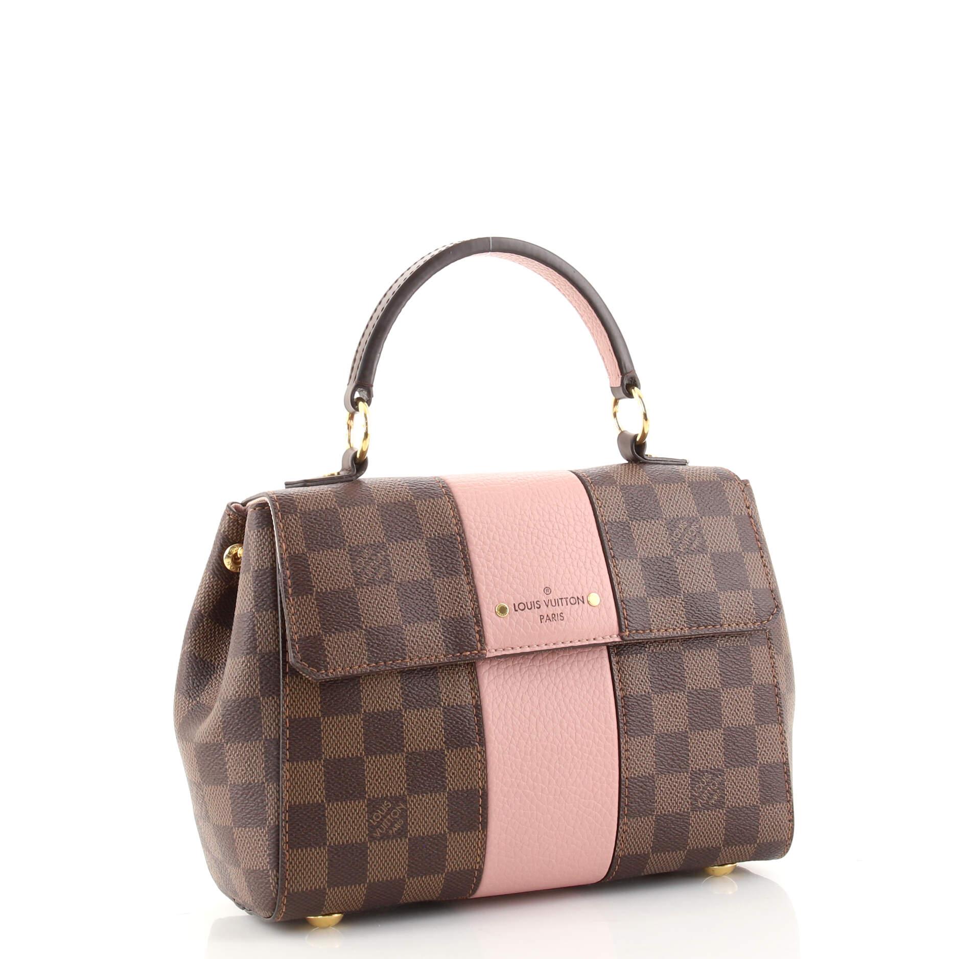 Condition: Very good. Odor in interior. Scuffs and small marks on leather trims, handle and strap, darkening on rear. Darkening, wear and marks underneath flap and in interior, scratches on hardware.
Accessories: Dust Bag, With Strap
Measurements: