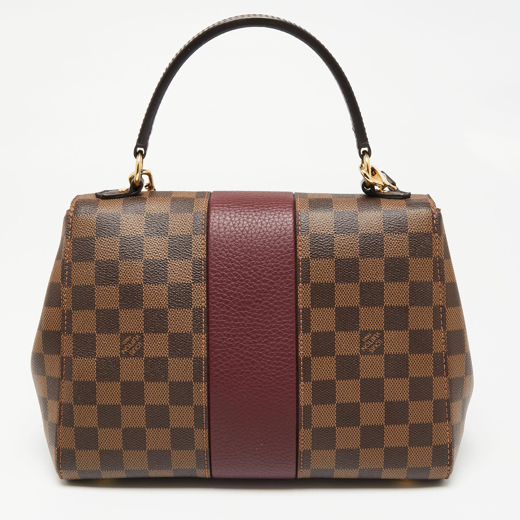 Designed to last, this flap bag from Louis Vuitton can elevate your wardrobe. This functional bag in brown can be used for work or otherwise. Made using coated canvas and leather, it is spacious and high on appeal.

Includes: Detachable Strap