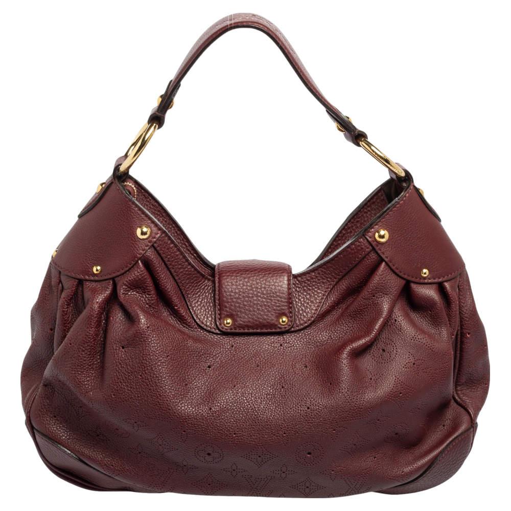 This stylish Solar PM bag from the House of Louis Vuitton will make all your handbag dreams come true! It is made from Bordeaux Monogram Mahina leather with a gold-toned lock closure attached to the front. The spacious interior is lined with